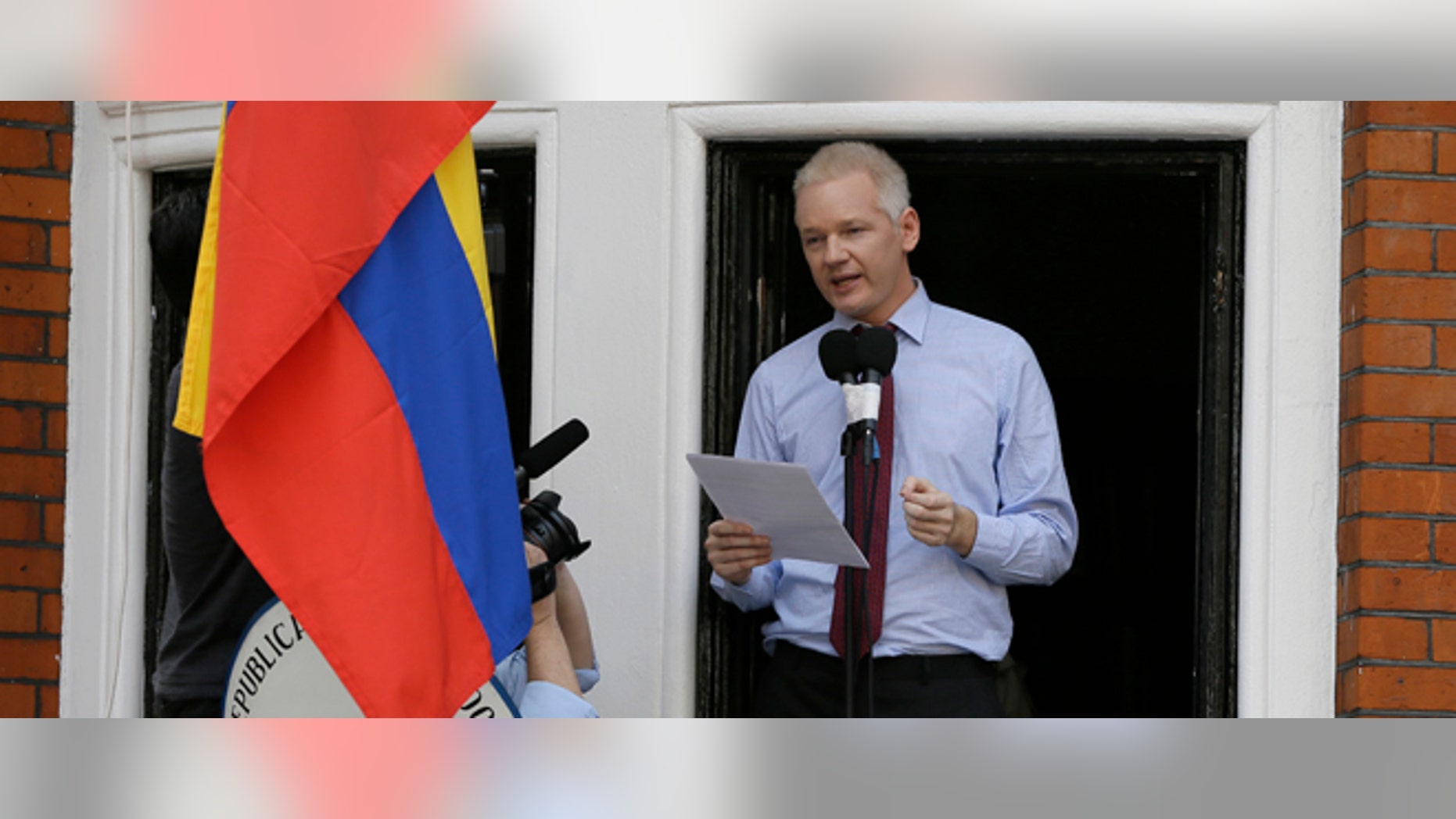 Julian Assange, founder of WikiLeaks makes a statement from a balcony of the Equador Embassy in London, Sunday, Aug. 19, 2012. Assange called on United States President Barack Obama to end a "witch hunt" against the secret-spilling WikiLeaks organization.(AP Photo/Kirsty Wigglesworth)