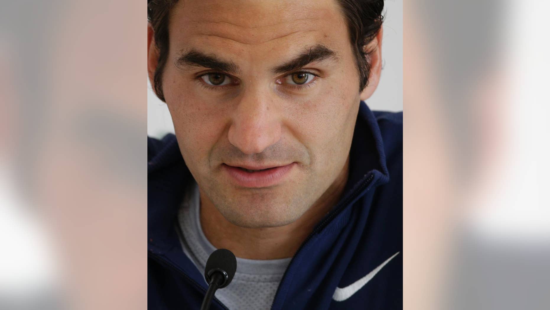 Roger Federer of Switzerland listens to reporters' questions during a press conference at the Italian Open tennis tournament, in Rome, Tuesday, May 13, 2014. (AP Photo/Alessandra Tarantino)