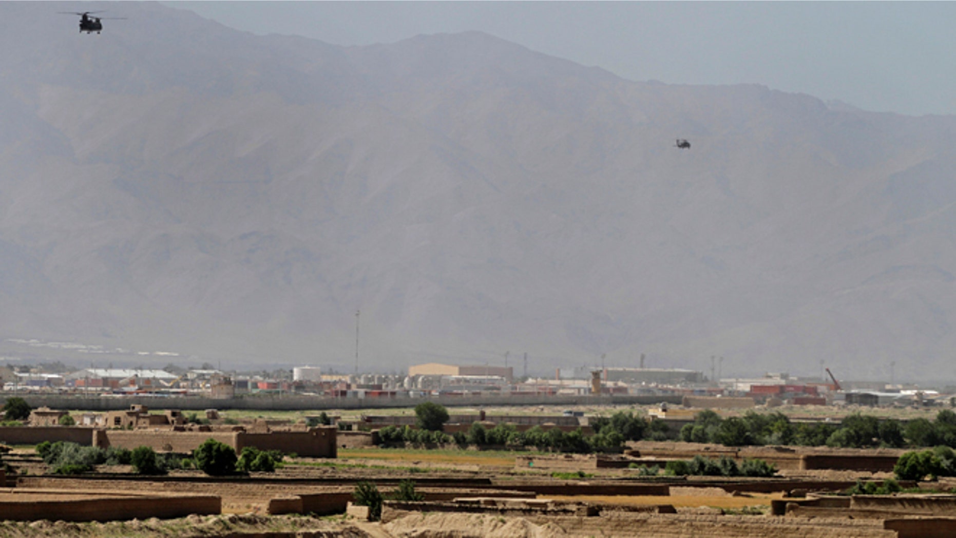 June 19, 2013: Helicopters take off from Bagram military base, 31 miles north of Kabul, in Afghanistan. (AP/Ahmad Jamshid)