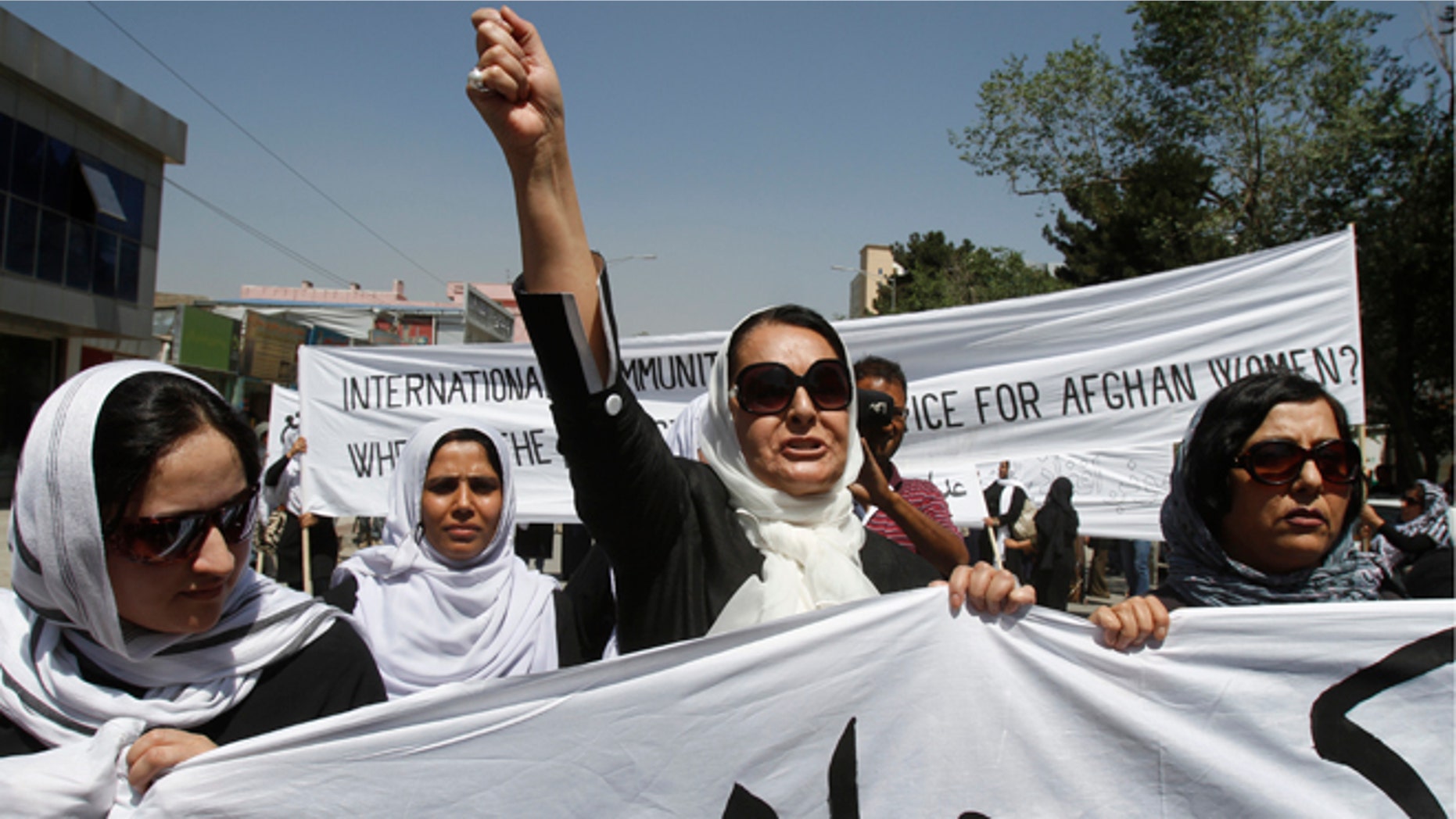 July 11, 2012: An Afghan protestor shouts slogans during a demonstration in support of female victims of abuse and violence in Kabul, Afghanistan.