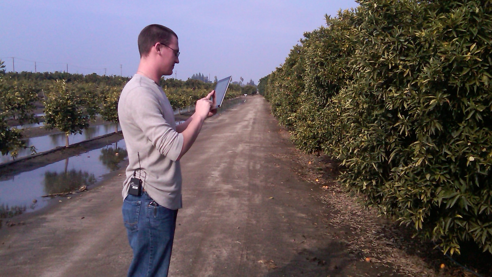 SFC Jarrod Mattison with the US Army Reserve, using an app to learn more about the crops he'll encounter in Afghanistan.