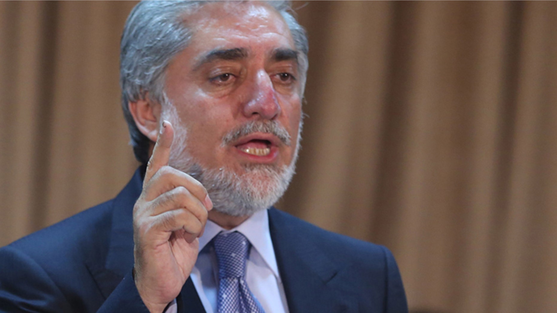 Afghanistan's presidential candidate Abdullah Abdullah speaks during a news conference in Kabul, Afghanistan, Sunday, June 15, 2014. The two candidates, former Foreign Minister Abdullah Abdullah and former Finance Minister Ashraf Ghani Ahmadzai, have both vowed to improve ties with the West. (AP Photo/Massoud Hossaini)