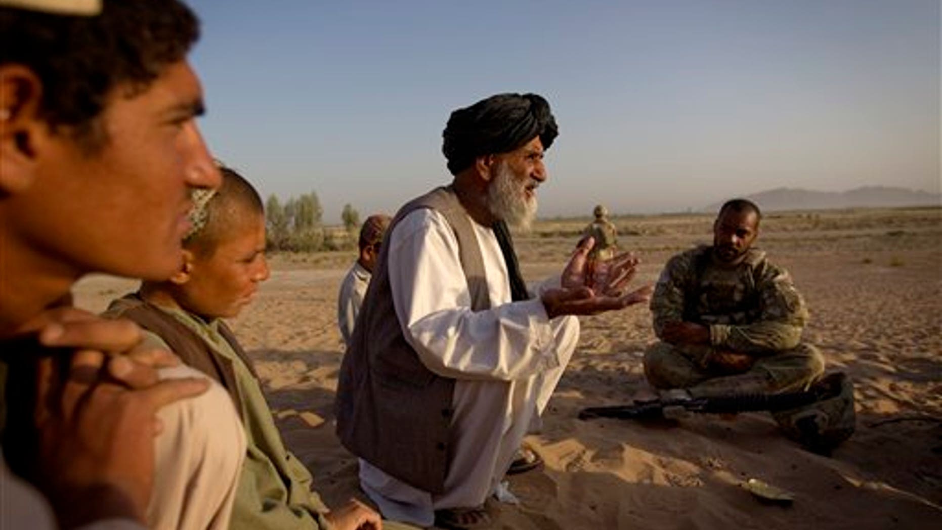 June 27. An Afghan man talks to an American soldier about bringing much needed essential services, such as water and power, to their village. Such services are being provided in the hope of winning over the hearts and minds of the Afghan people. However, intelligence leaders have recently placed a greater emphasis on more traditional ways of targeting the Taliban-led insurgency, such as mapping enemy networks and behavior.