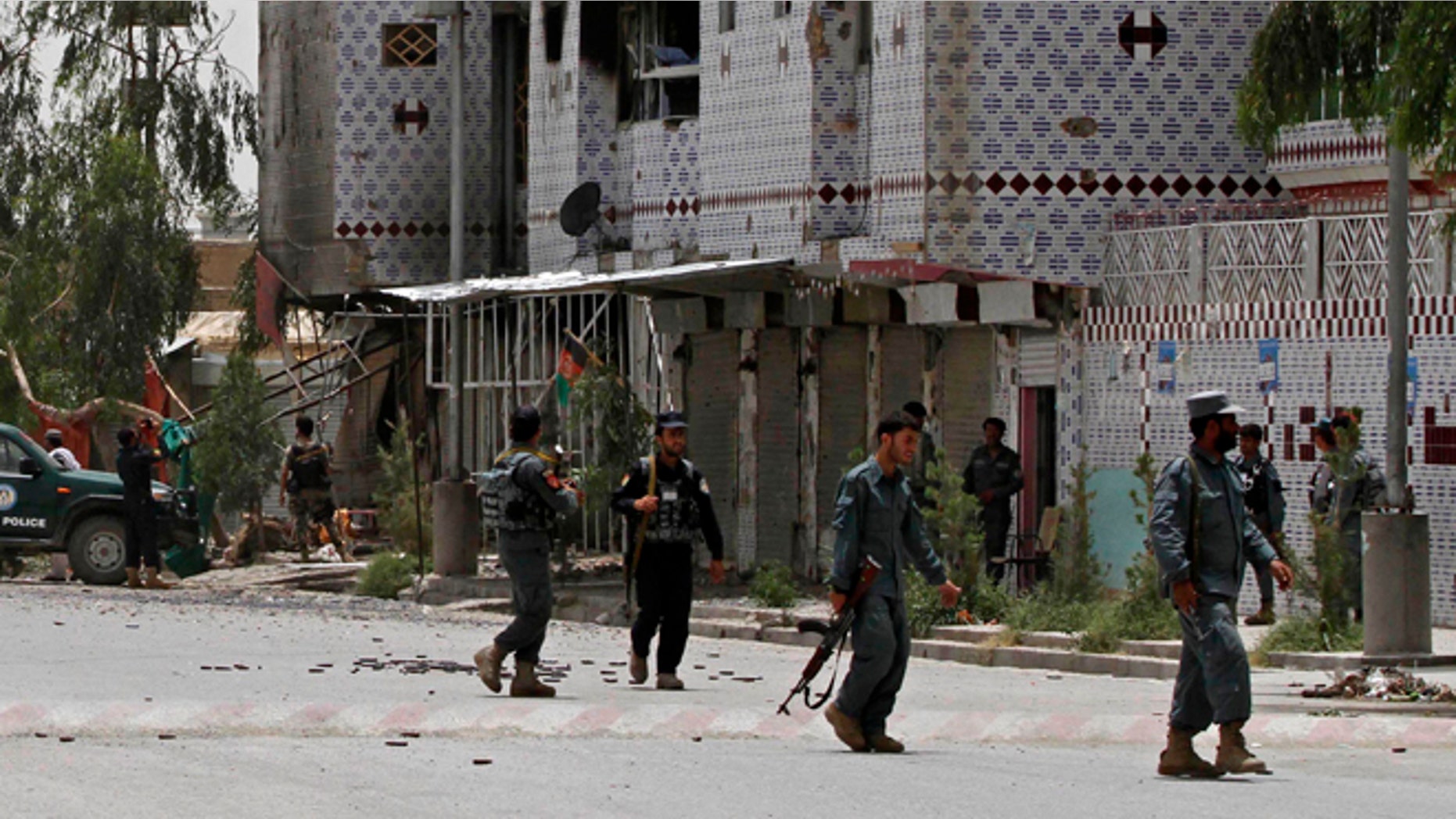 June 15, 2014: Afghan forces gather during clashes with Taliban fighters in Kandahar, southern Kabul, Afghanistan. (AP)