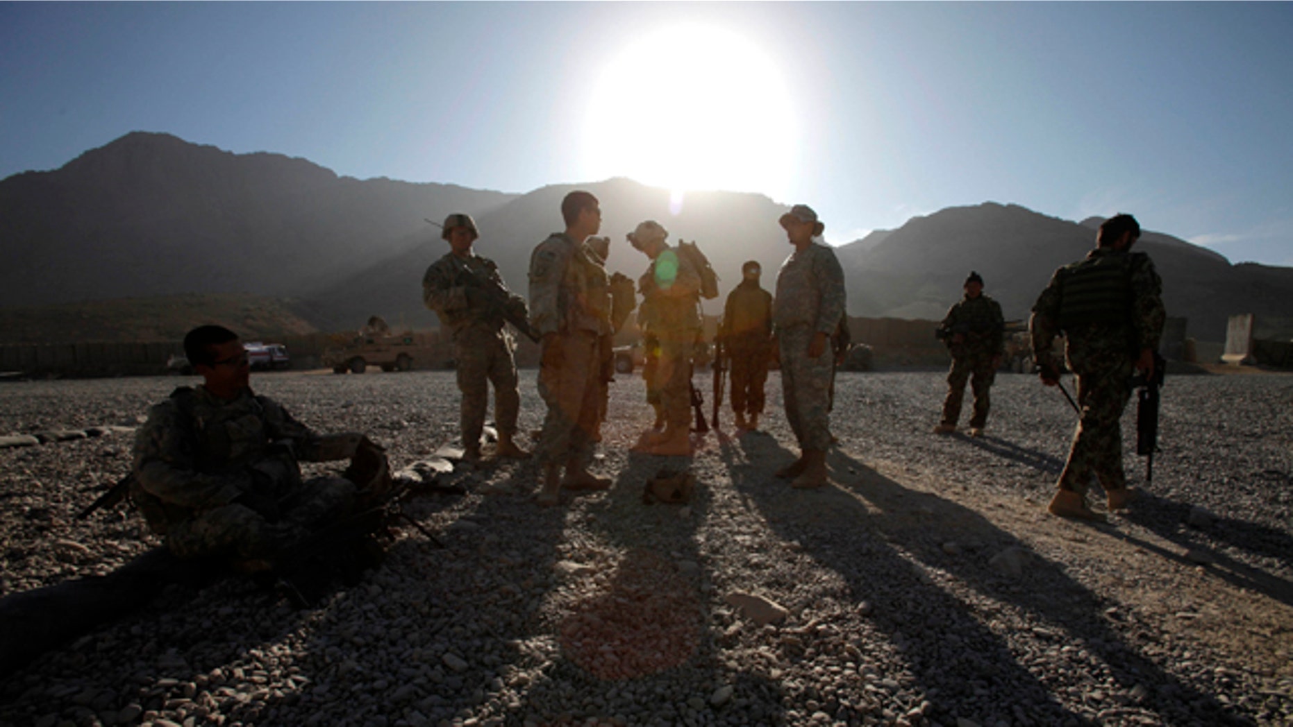 Nov. 22: U.S. Army soldiers and Afghan policemen prepare themselves for a foot patrol in West Now Ruzi village, district Panjwai, in Afghanistan.