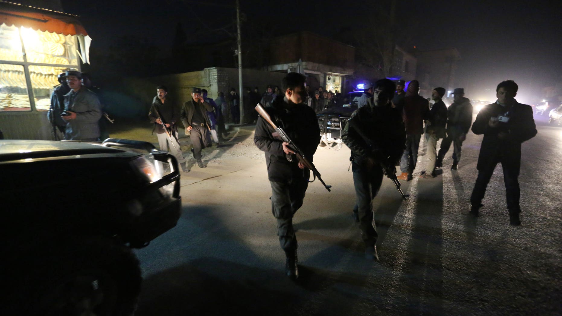 Afghan security forces inspect the site of an explosion in Kabul.