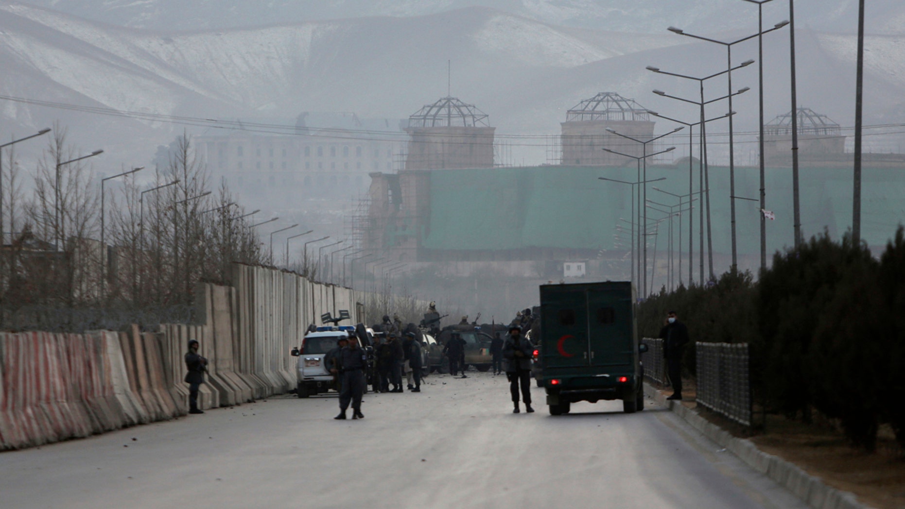Afghan security forces inspect the site of two large bombings in Kabul, Afghanistan, Tuesday, Jan. 10, 2017.