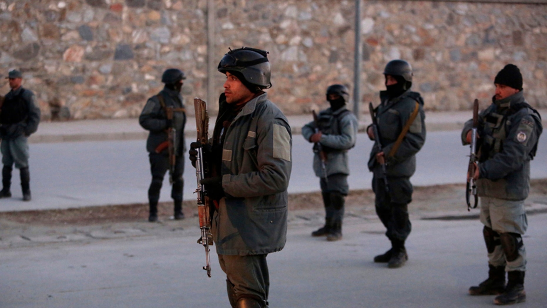 Afghan security forces inspect the site of two large bombings in Kabul, Afghanistan, Tuesday, Jan. 10, 2017. Two loud explosions have rocked the Afghan capital of Kabul, causing casualties. The target of the blasts was probably an area that includes government and lawmakers' offices. Sediq Sediqqi, spokesman for the Interior Ministry, said that first, a suicide bomber carried out an attack, followed by a second explosion, caused by car bomb parked near the site. (AP Photo/Rahmat Gul)