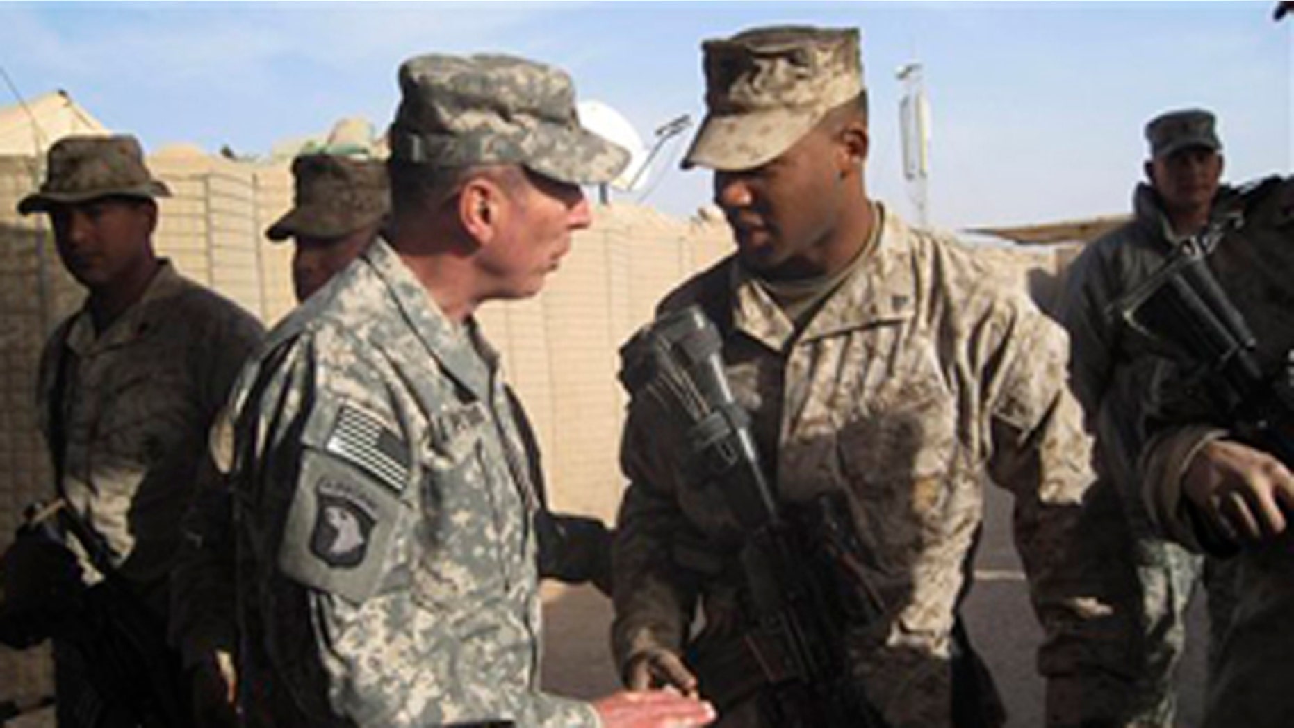 Dec. 25, 2010: Gen. David Petraeus, left, top U.S. and NATO commander in Afghanistan, meets U.S. marines during his visit to Marjah, Afghanistan.