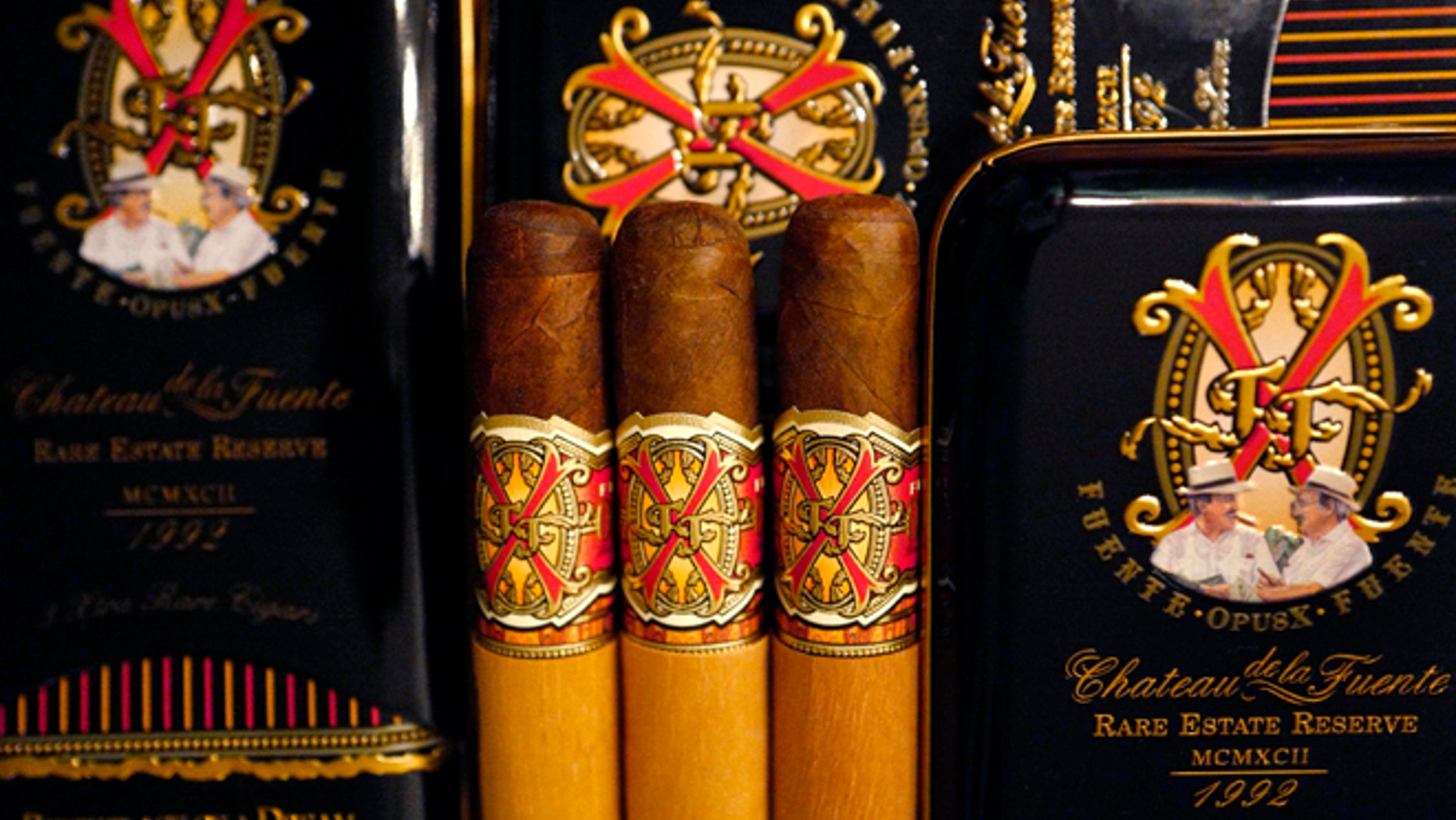 A selection of rare "Opus X" cigars made in the Domenican Republic by Arturo Fuente are on display at the duty free shop of Atatuerk airport in Istanbul, Turkey, March 25, 2016. REUTERS/Kai Pfaffenbach - RTSCN6I