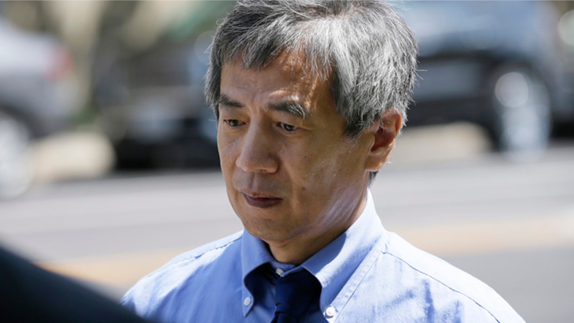 July 1, 2014: Former Iowa State University researcher Dong-Pyou Han leaves the Federal Courthouse.