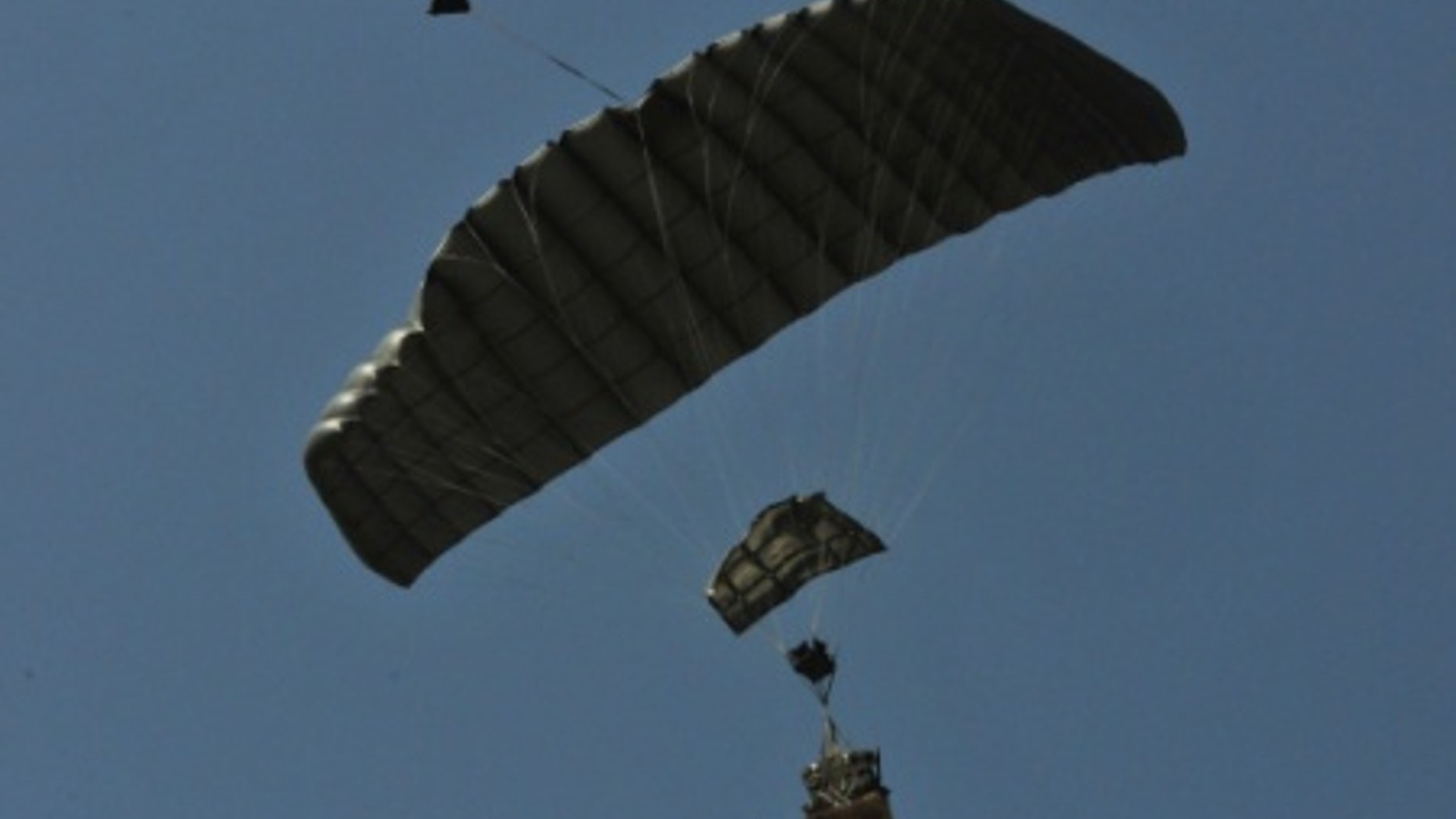 File photo - A joint precision airdrop system (JPADS) guides itself to the ground following its drop from a C-130 aircraft at Normandy Drop Zone in Fort Bragg, N.C., May 23, 2013. (U.S. Army photo by Sgt. Amanda Tucker/Released)