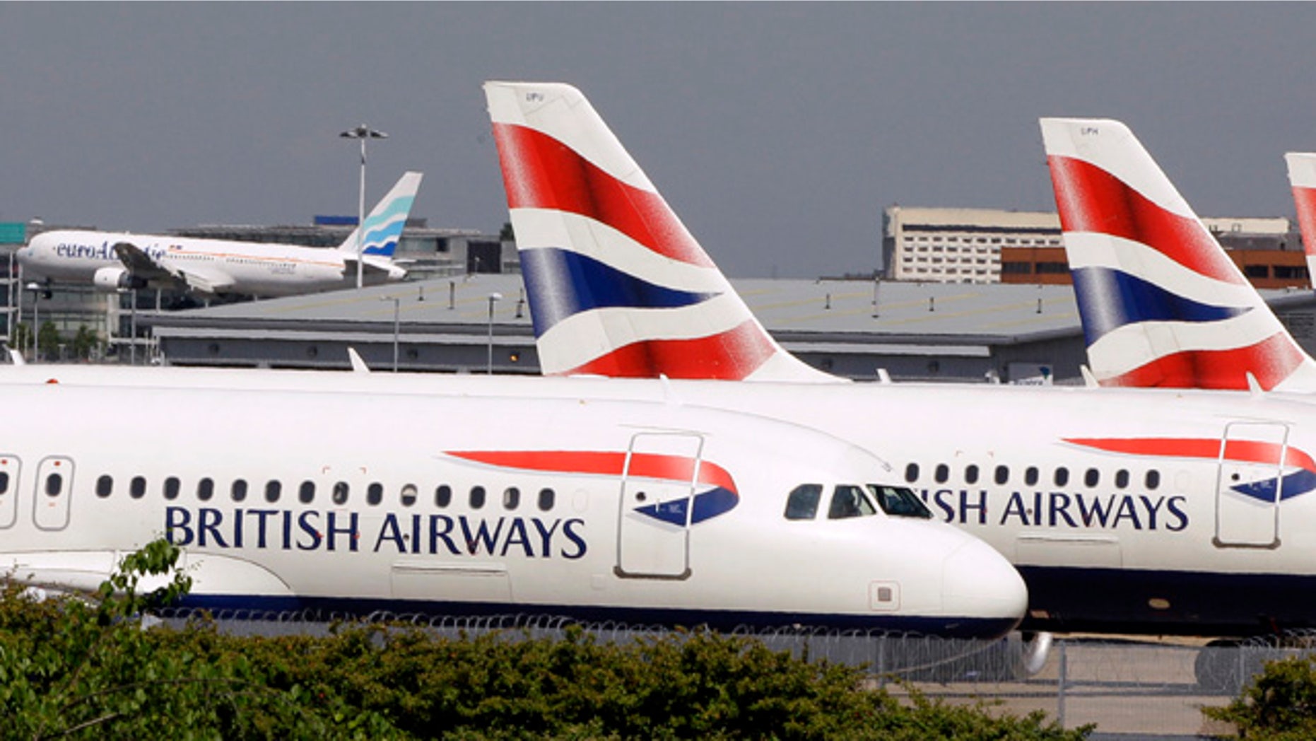 In this May 24, 2010 file photo, British Airways planes are seen parked at Heathrow Airport in London. According to federal prosecutors, when the airline industry took a nose dive a decade ago industry executives tried to fix it with a massive price-fixing scheme among airlines the world over, that artificially inflated passenger and cargo fuel surcharges to help companies make up for lost profits. Convicted airlines include British Airways, Korean Air, and Air France-KLM. No major U.S. carriers have been charged. (AP)