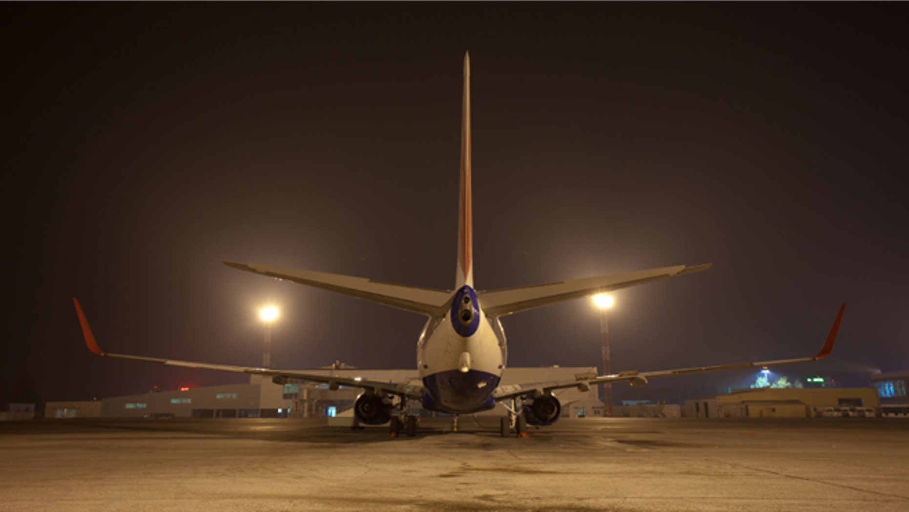 big air jet on ground at night