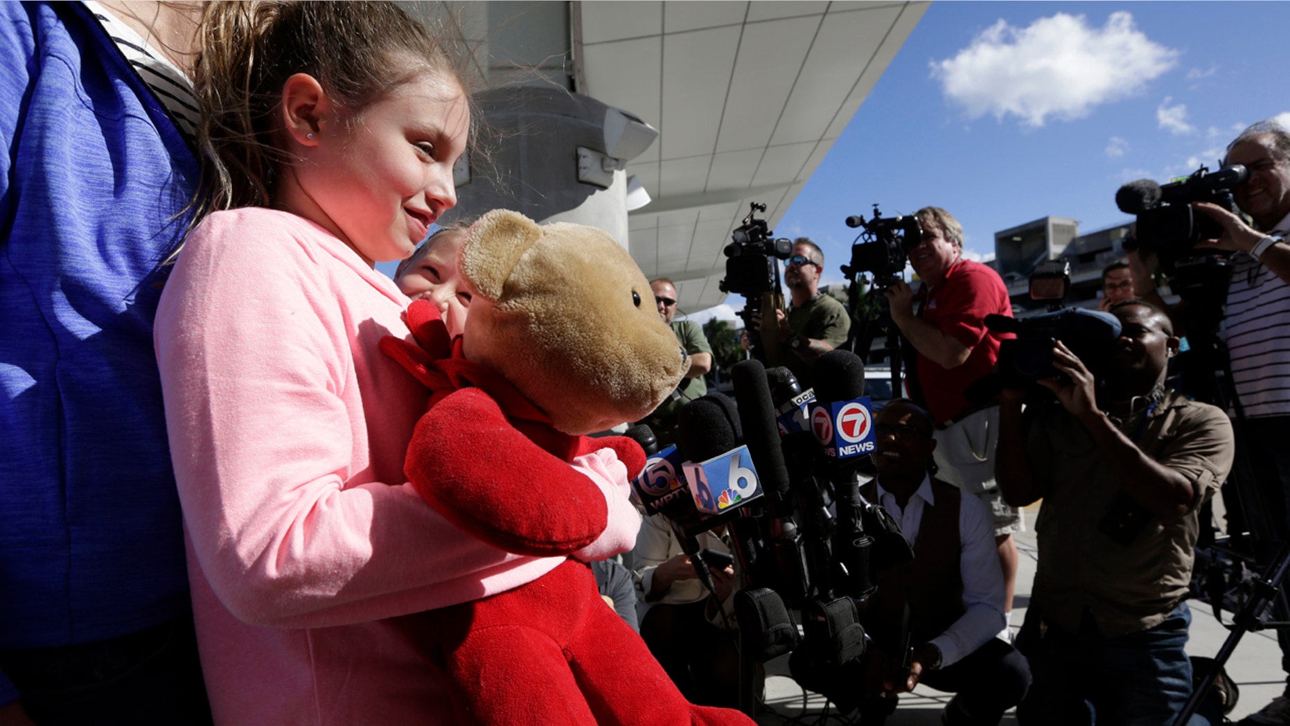 Courtney Gelinas talks with the news media after being reunited with her bear Rufus, at the Fort Lauderdale-Hollywood International Airport, Tuesday, Jan. 10, 2017, in Fort Lauderdale, Fla