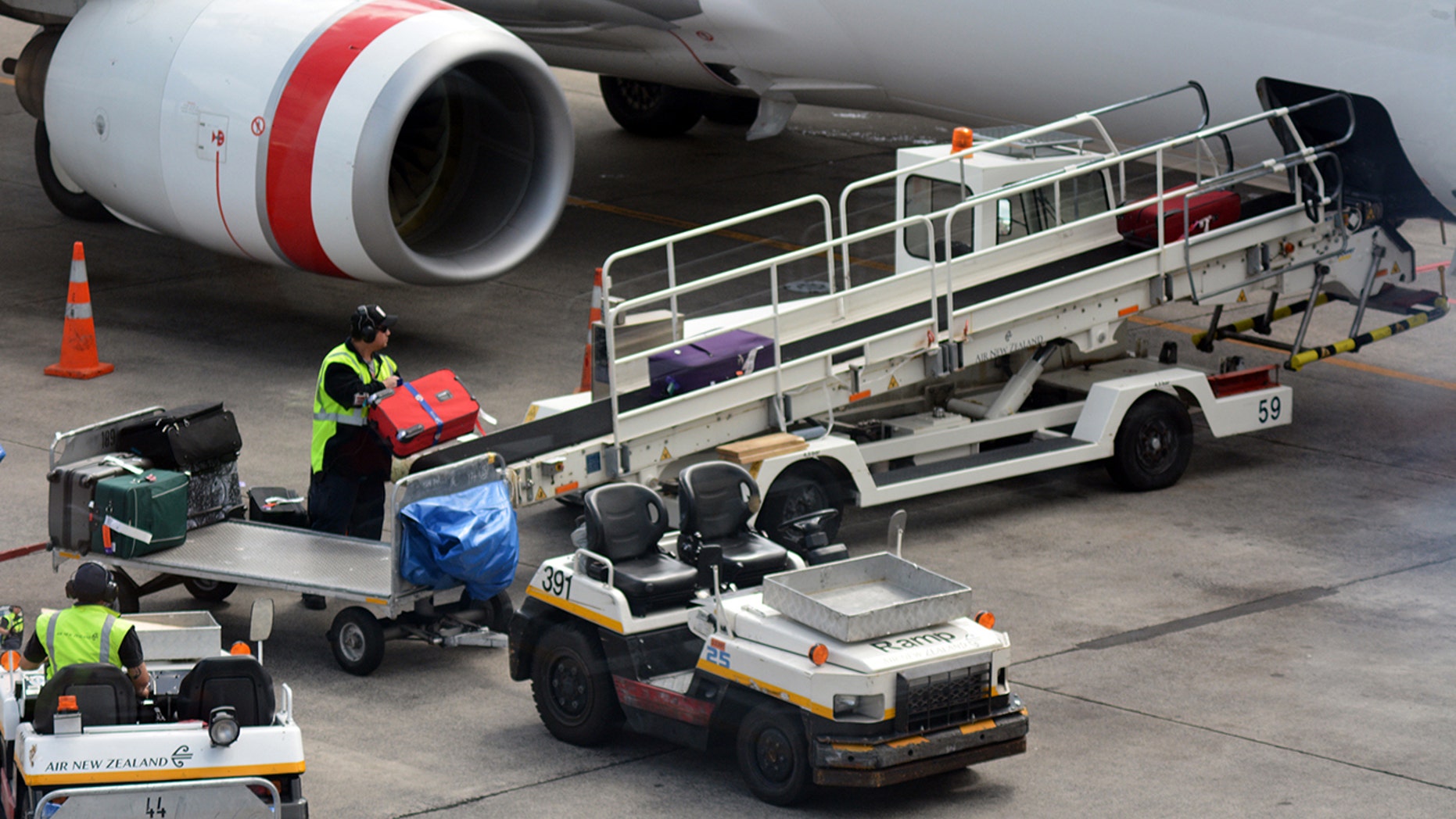 An airport worker has been arrested and charged for stealing contents out of passengers' checked luggage.