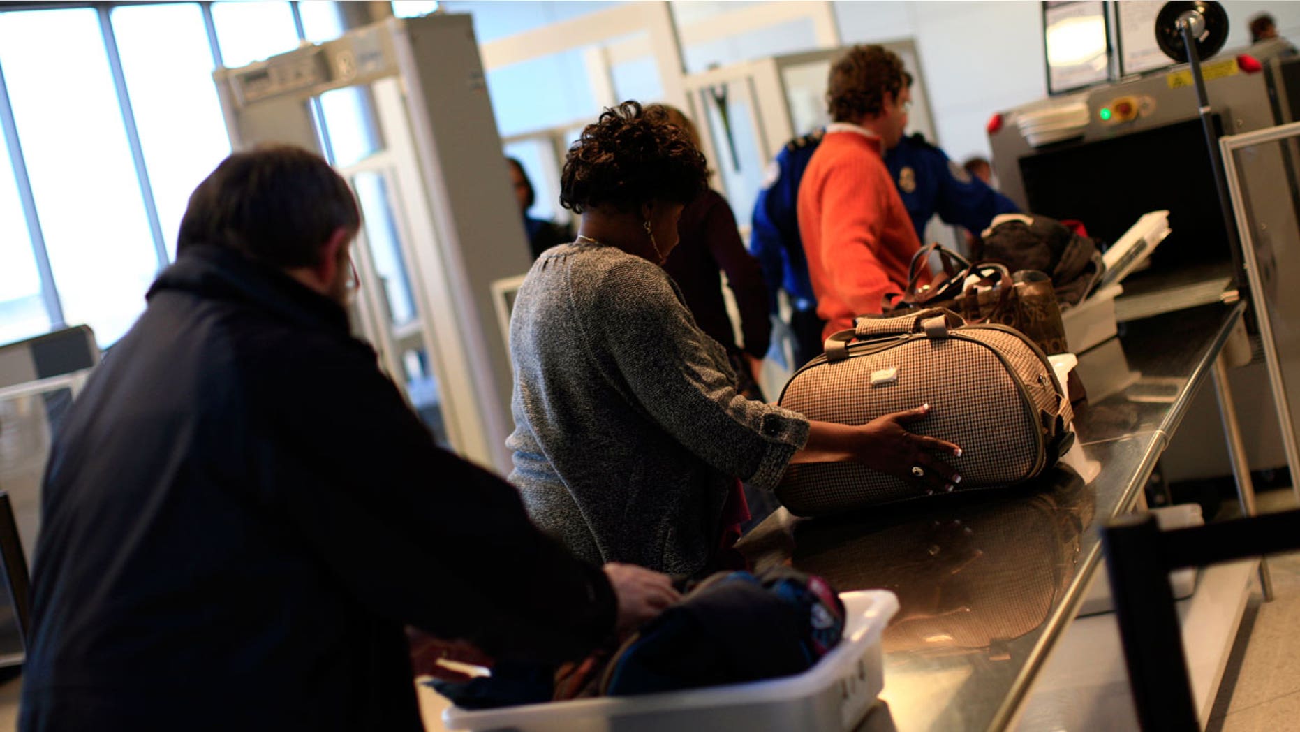 An elderly woman at the Dwight D. Eisenhower National Airport wasn't about to give up her bottle without a fight.