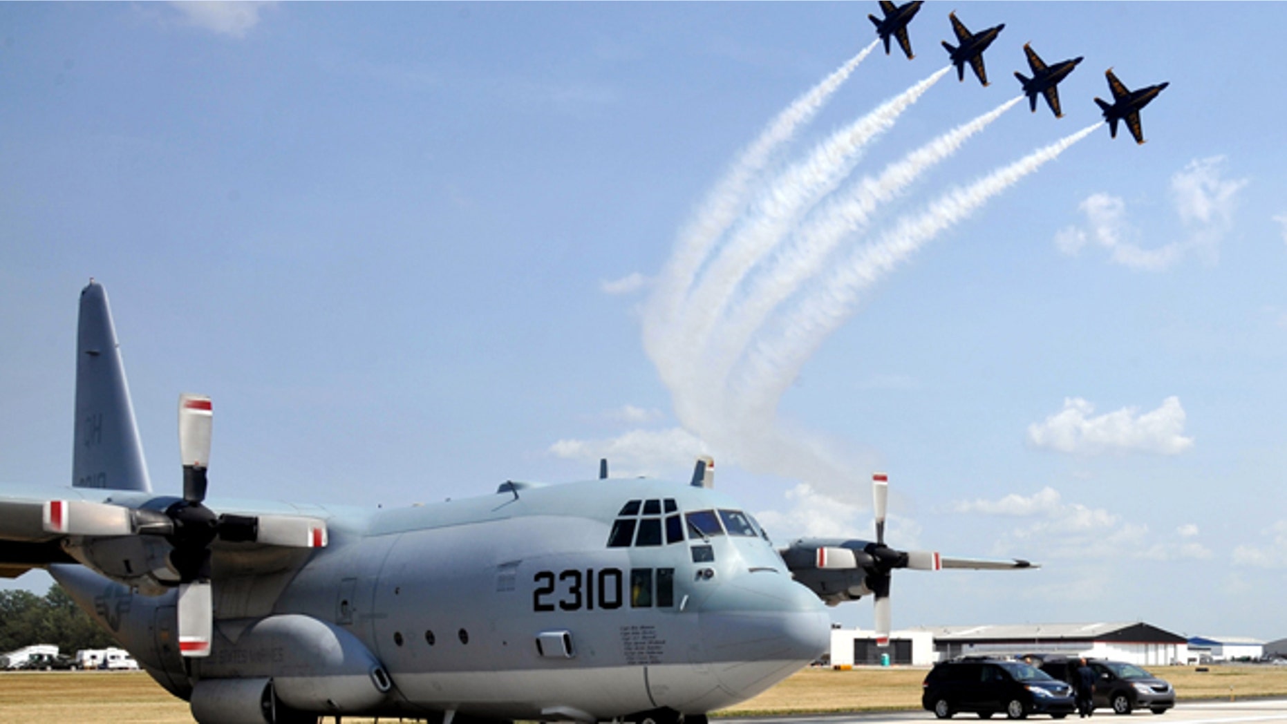FILE 2012: Blue Angels and world-renowned aerobatic pilot Michael Goulian form up for a flight over Vandalia, Ohio.