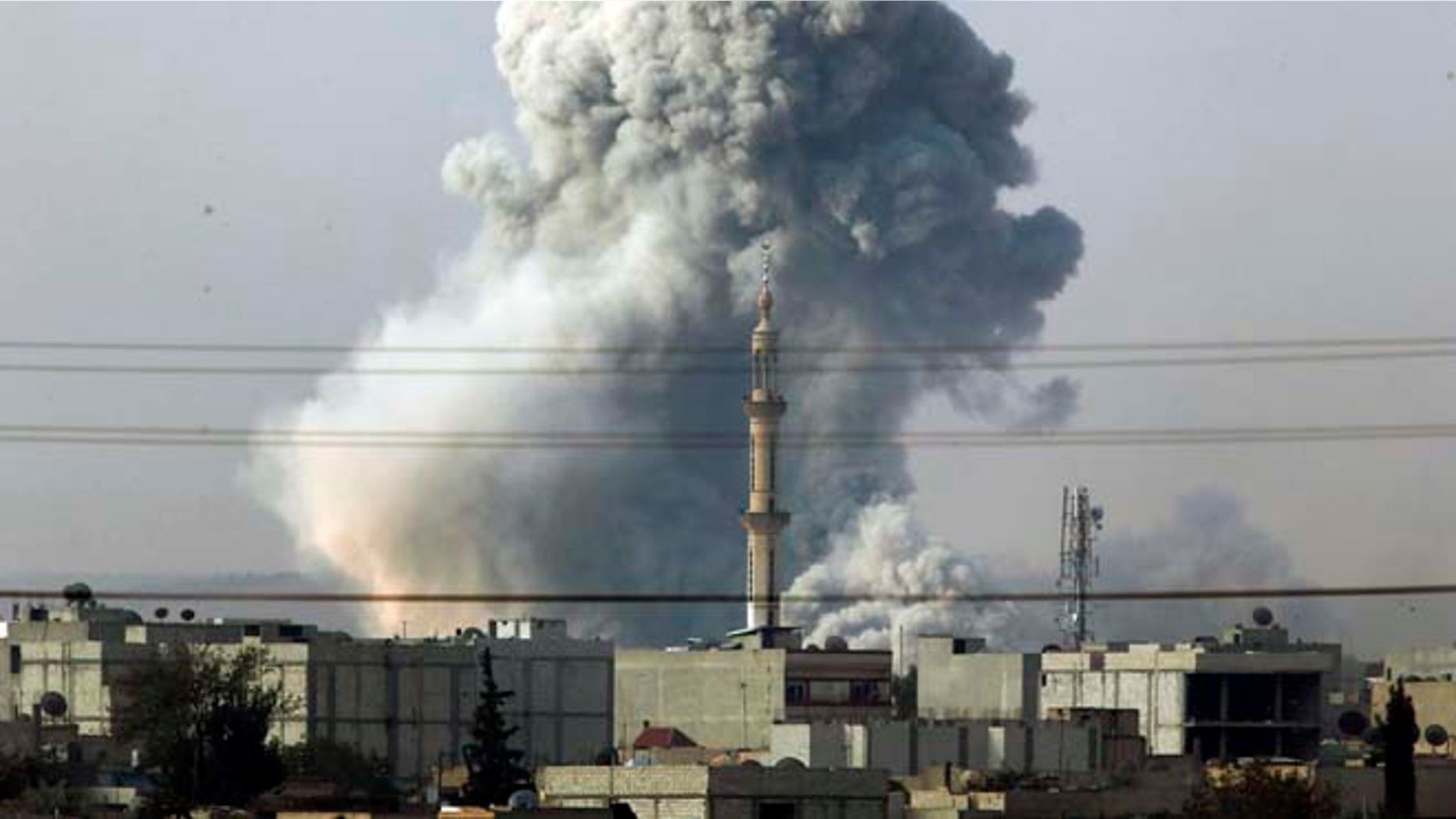 Oct. 14, 2014: Smoke rises following an airstrike by the U.S.-led coalition in Kobani, Syria as fighting continues between Syrian Kurds and the militants of Islamic State group, as seen from Mursitpinar, on the outskirts of Suruc, at the Turkey-Syria border. Kobani, also known as Ayn Arab, and its surrounding areas, has been under assault by extremists of the Islamic State group since mid-September and is being defended by Kurdish fighters.