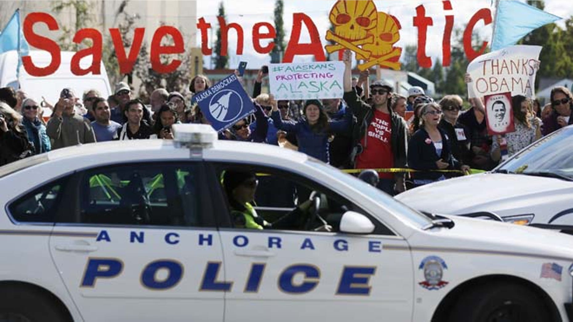Aug. 31: People protesting against Shell Oil greet President Obama's motorcade as he arrives to deliver remarks to the GLACIER Conference in Anchorage, Alaska.