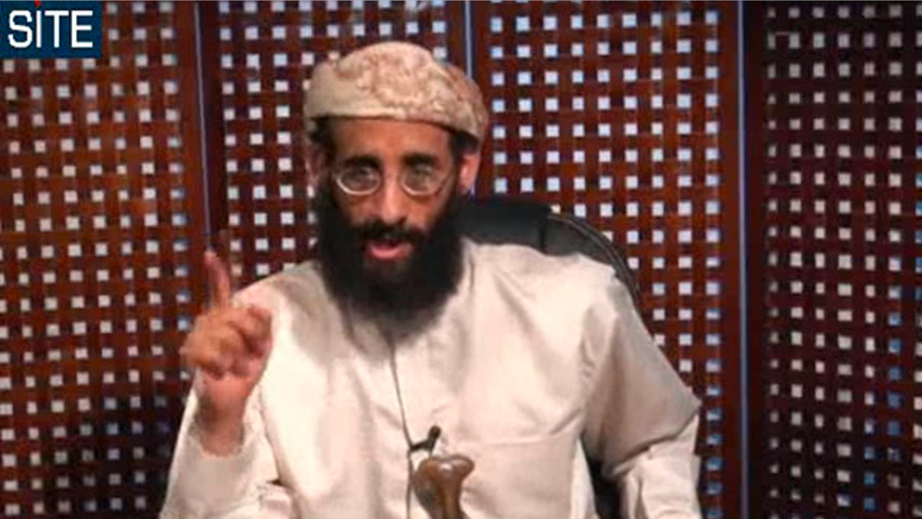 In this Nov. 8, 2010 file photo taken from video and released by SITE Intelligence Group, Anwar al-Awlaki speaks in a video message posted on radical websites.