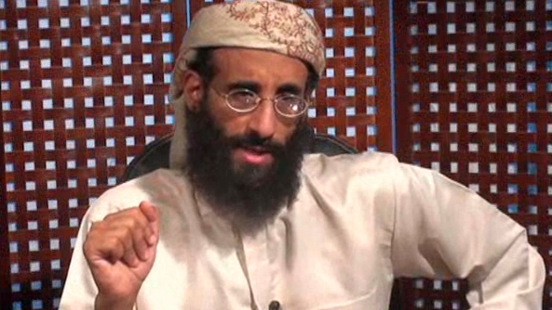 Monday, Nov. 8, 2010 file image taken from video and released by SITE Intelligence Group, Anwar al-Awlaki speaks in a video message posted on radical websites.