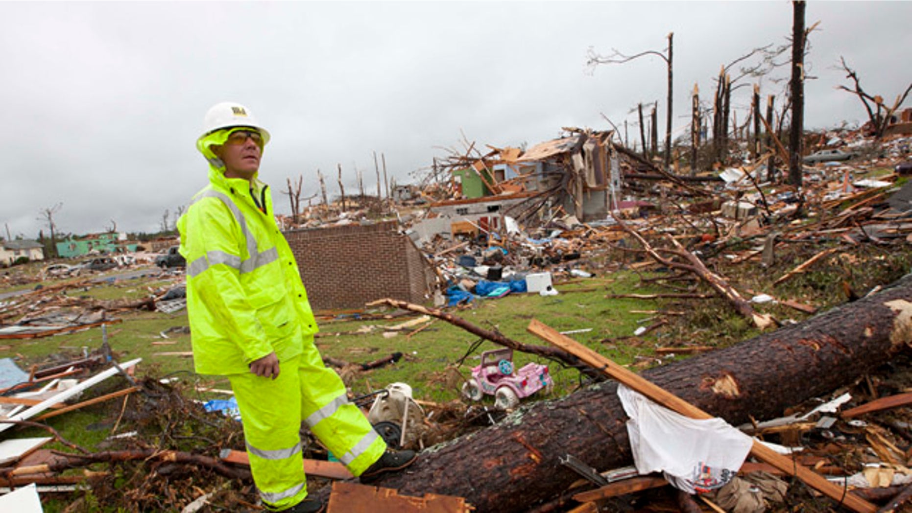 May 3: Lineman Derrick Heisz of Broadhead, Wis., surveys the damage in Pratt City, Ala.