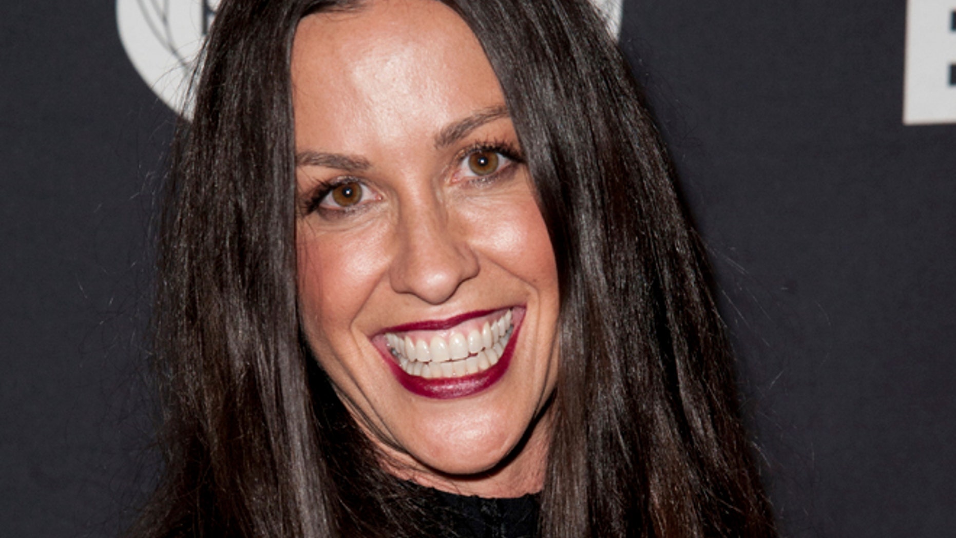 FILE - This June 20, 2014 file photo Alanis Morissette arrives at the 4th Annual Production Of The 24 Hour Plays After-Party in Santa Monica, Calif.