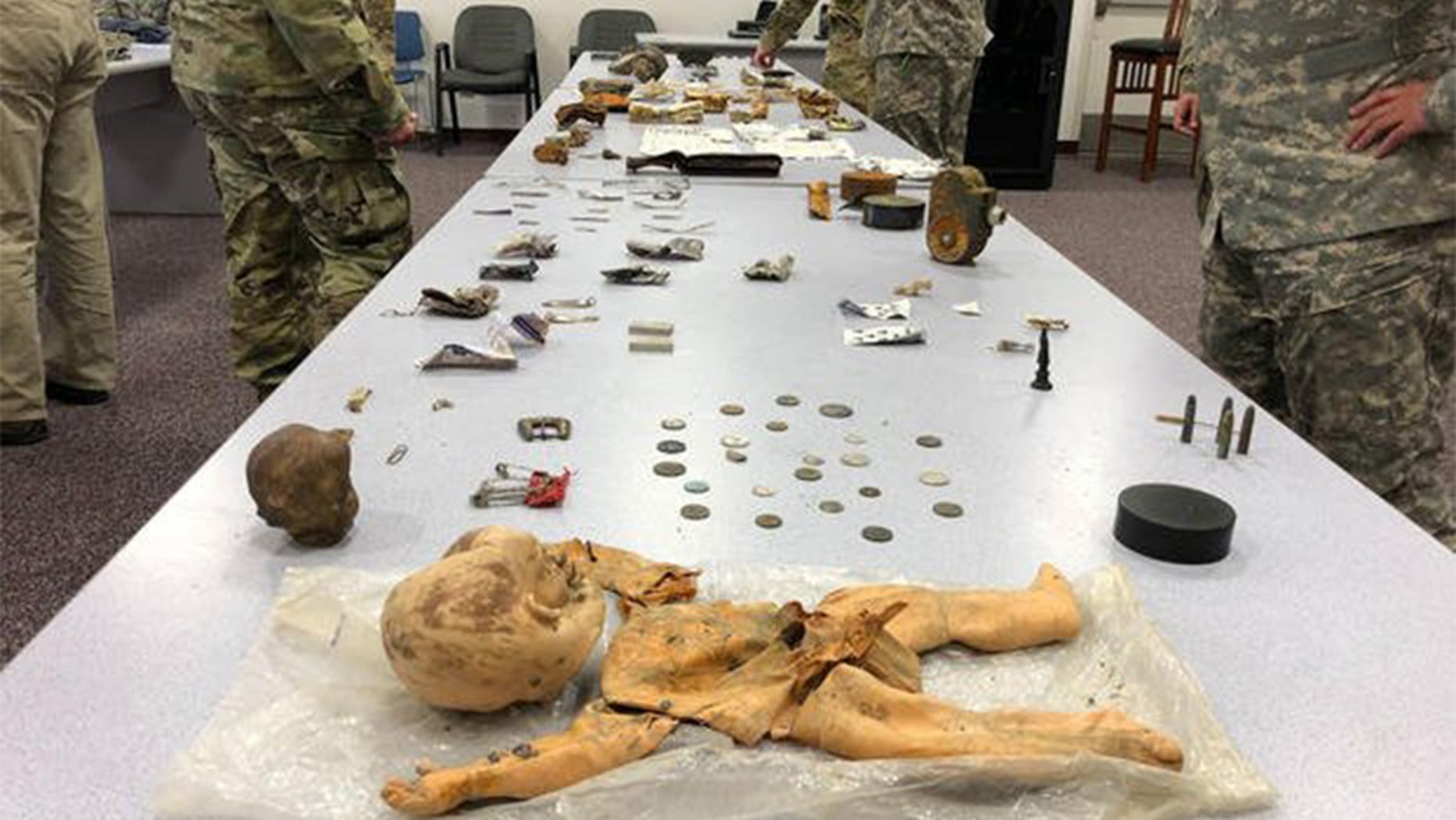 Some of items, such as a children's doll, recovered this summer at the crash site.