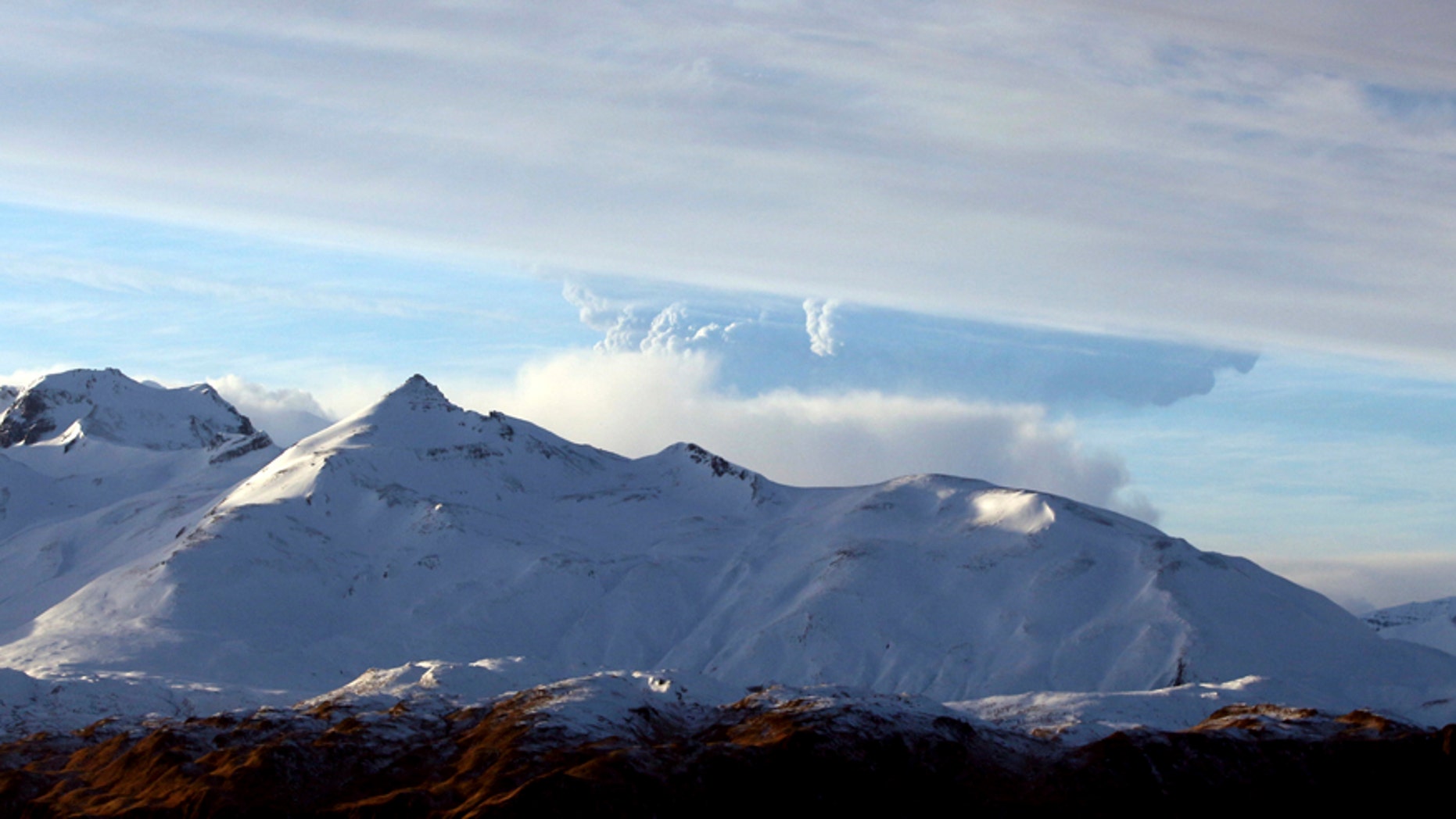 This photo taken Dec. 21, 2016 and provided by Lynda Lybeck Robinson shows the Bogoslof Volcano erupting in the Aleutian Islands, Alaska. The active Alaska volcano, which has erupted 10 times since mid-December and is located about 850 miles southwest of Anchorage, erupted again Thursday, Jan. 5, 2017, this time sending a cloud of ash and ice 35,000 feet in the air. (Lynda Lybeck Robinson via AP)