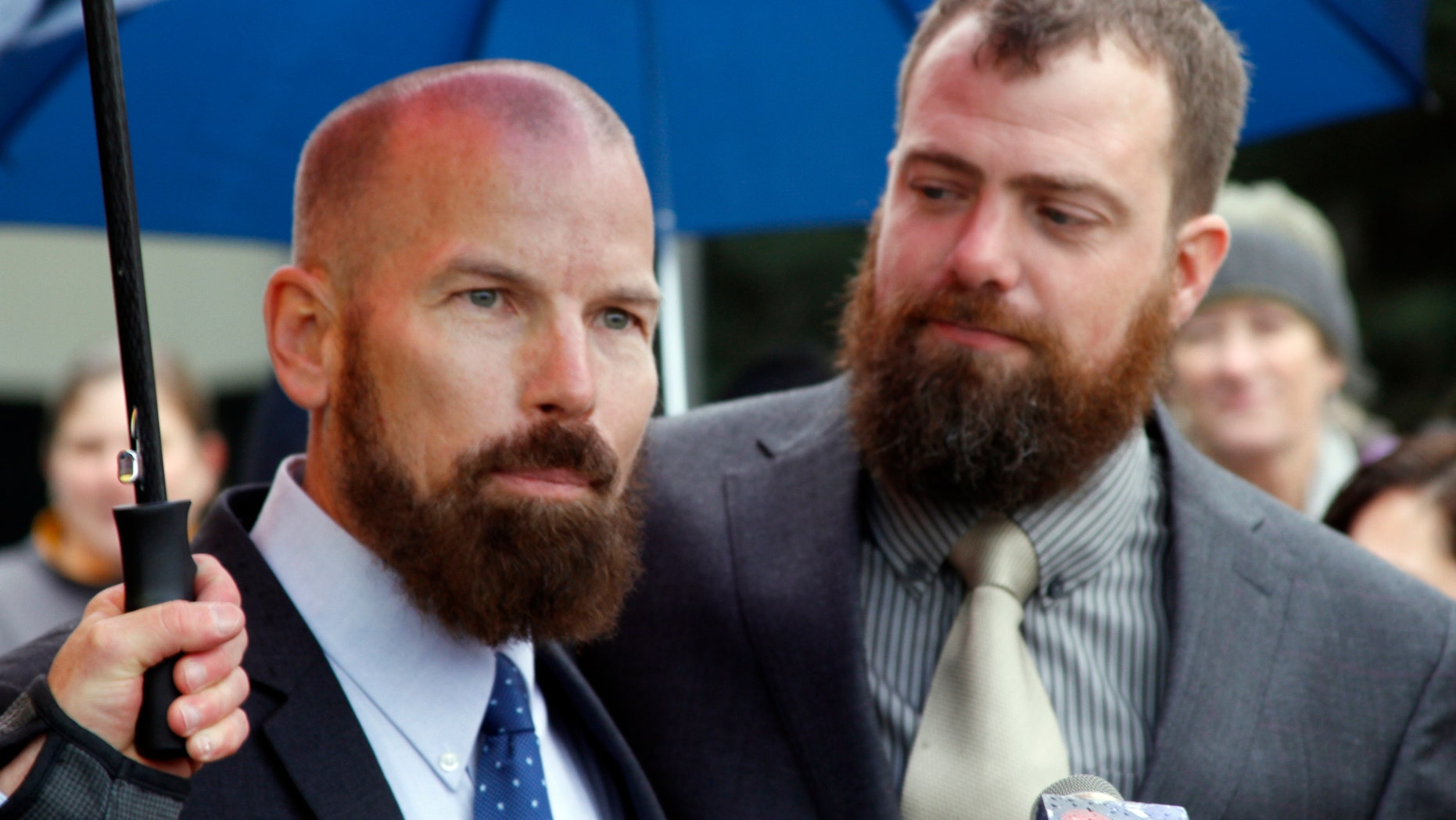 Oct. 10, 2014: Matthew Hamby, left, and Christopher Shelden speak during a news conference following a hearing.