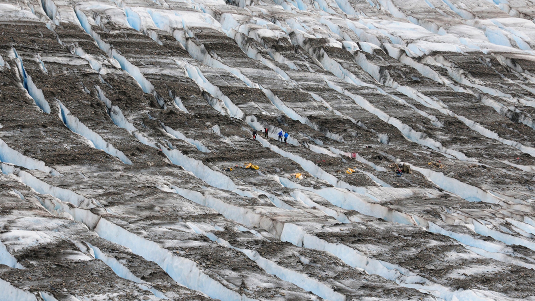 June 20, 2012: A specialized eight-person recovery team, with team members from the Joint POW/MIA Accounting Command and Northern Warefare Training Center, searches for aircraft wreckage, remains, or other personal affects while conducting recovery operations at an aircraft crash site on Knik Glacier near Anchorage, Alaska.