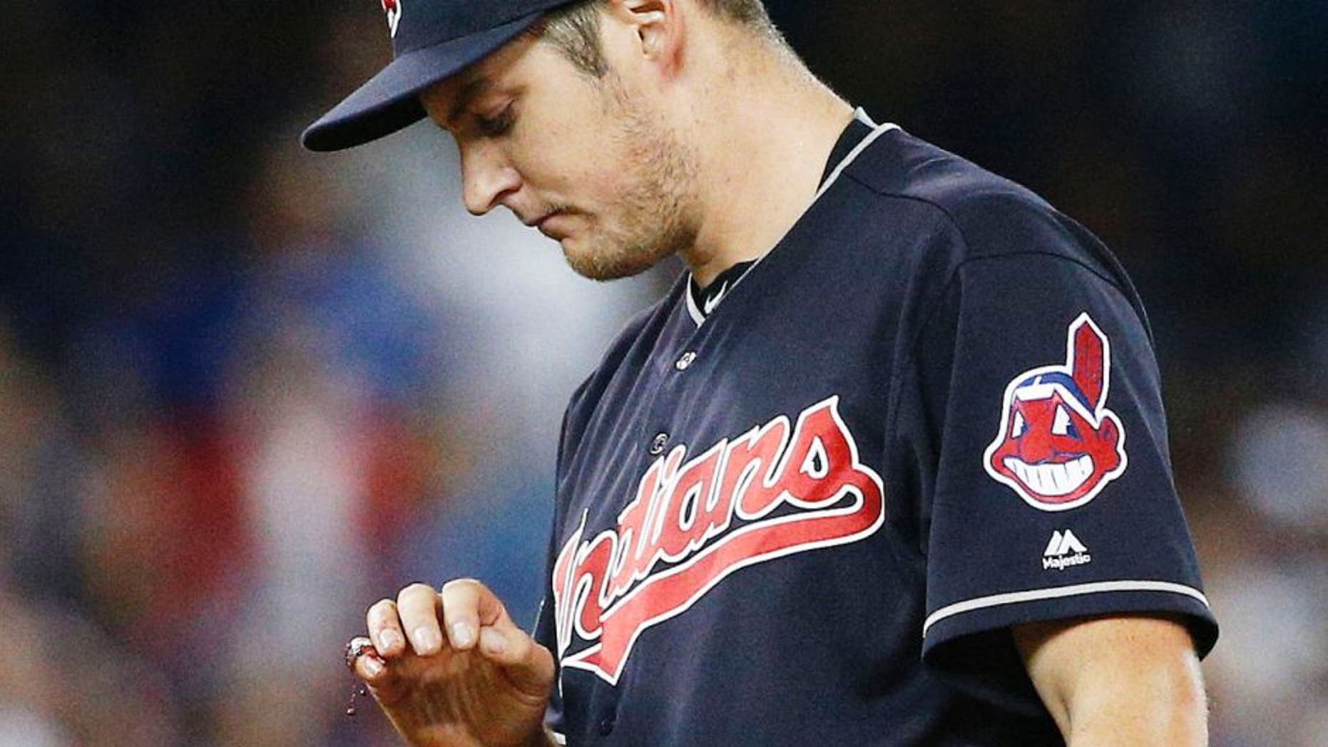 TORONTO, ON - OCTOBER 17 - Trevor Bauer #47 of the Cleveland Indians looking at his bloodied finger during the first inning in Game 3 of the ALCS baseball series against the Toronto Blue Jays at the Rogers Centre in Toronto, October 17, 2016 (Carlos Osorio/Toronto Star via Getty Images) (Carlos Osorio/Toronto Star via Getty Images)