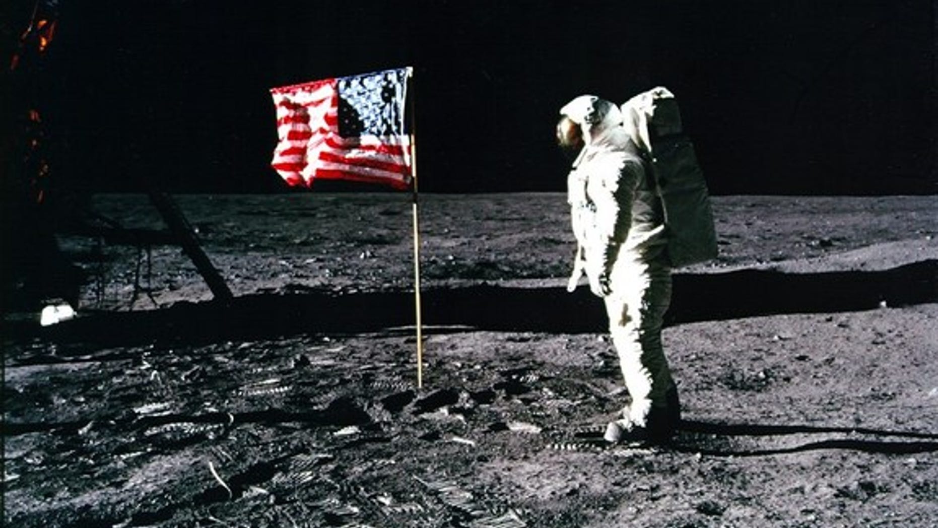 Buzz Aldrin salutes the U.S. flag on the surface of the moon.