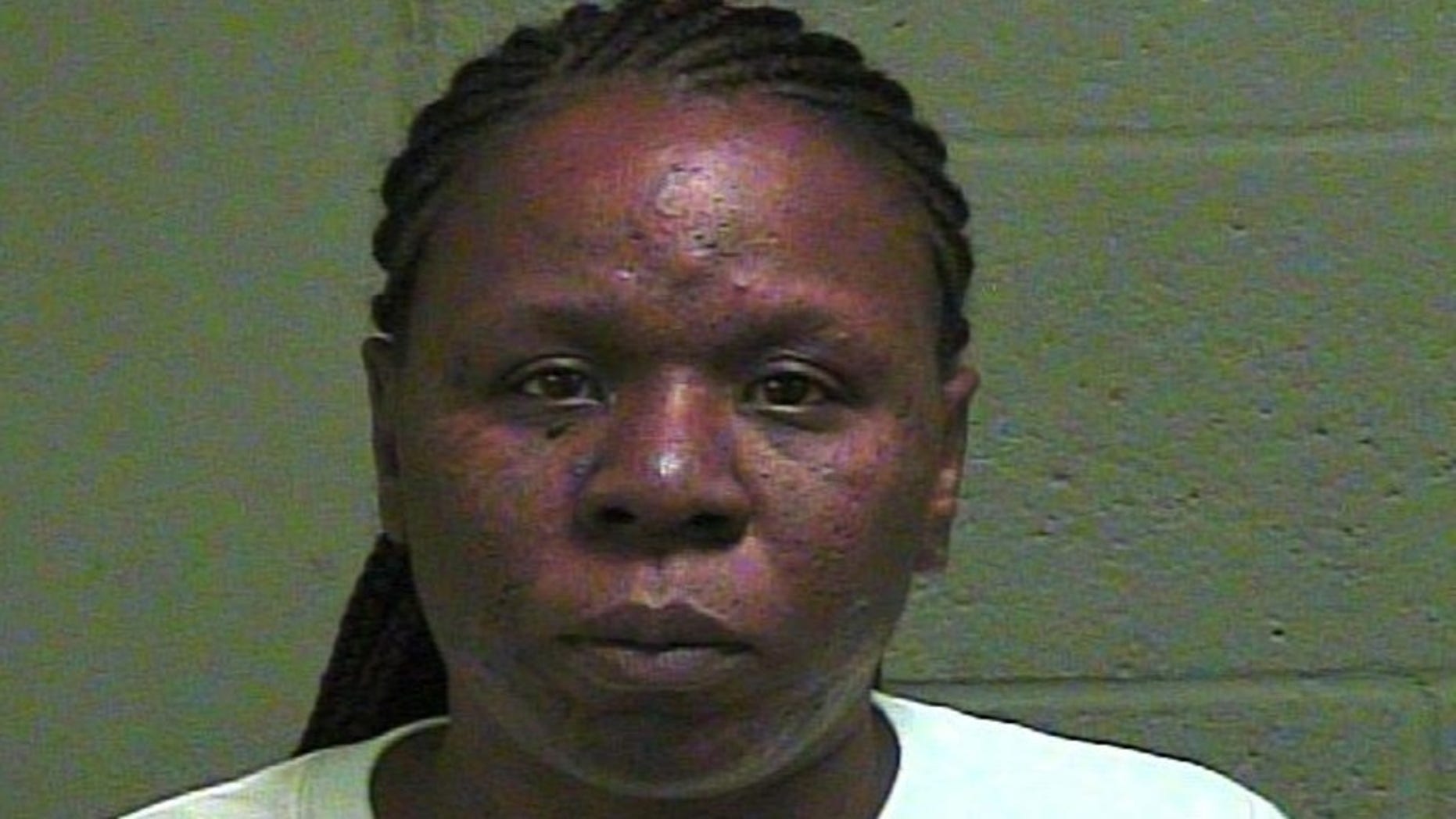 Alenea Bright, 40, allegedly stabbed a man in the back during a fight at a 1-year-old's birthday party.
