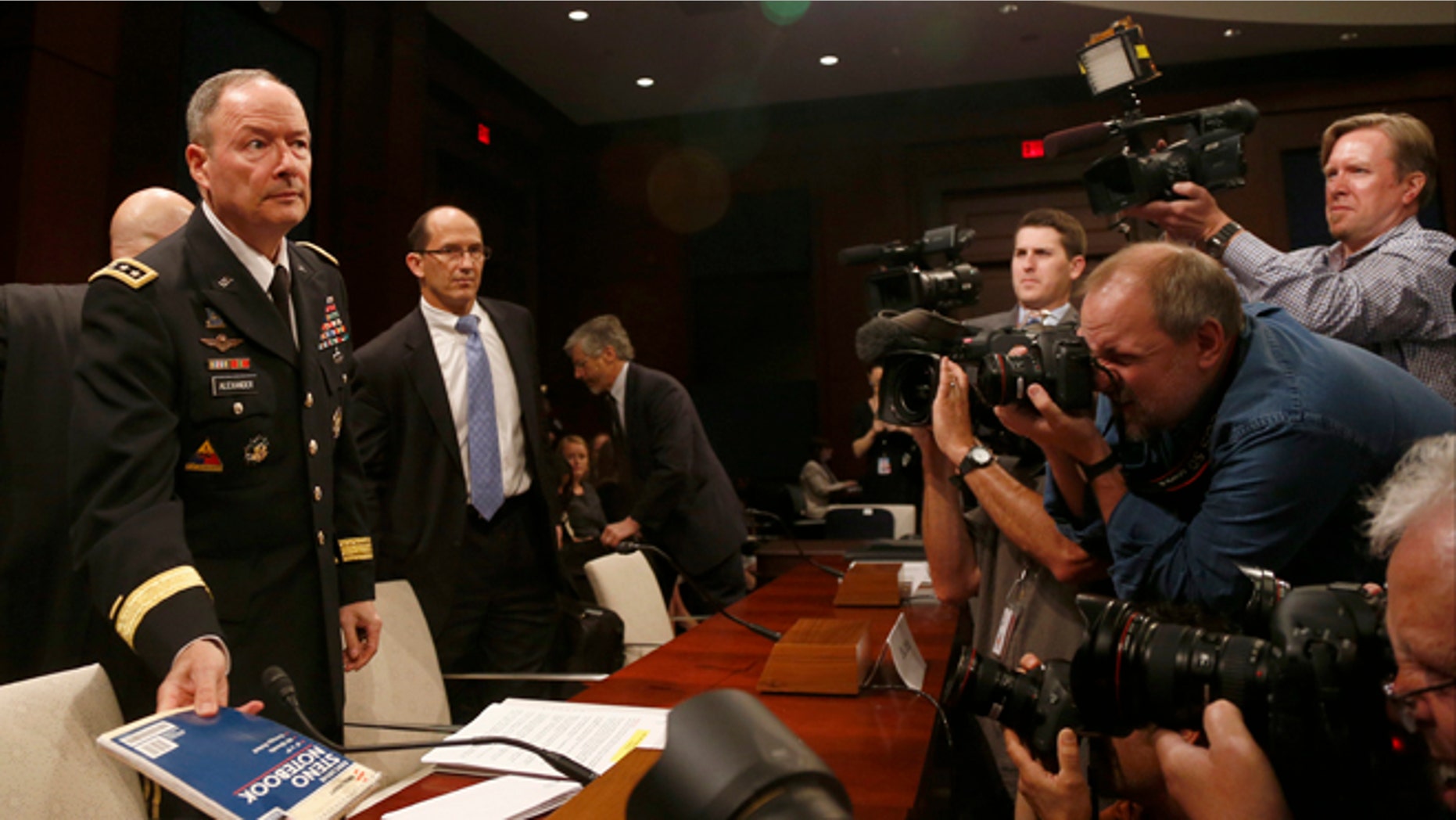 June 18, 2013: From left: National Security Agency Director Gen. Keith B. Alexander; Deputy FBI Director Sean Joyce; and Robert Litt, general counsel to the Office of the Director of National Intelligence arrive on Capitol Hill in Washington.