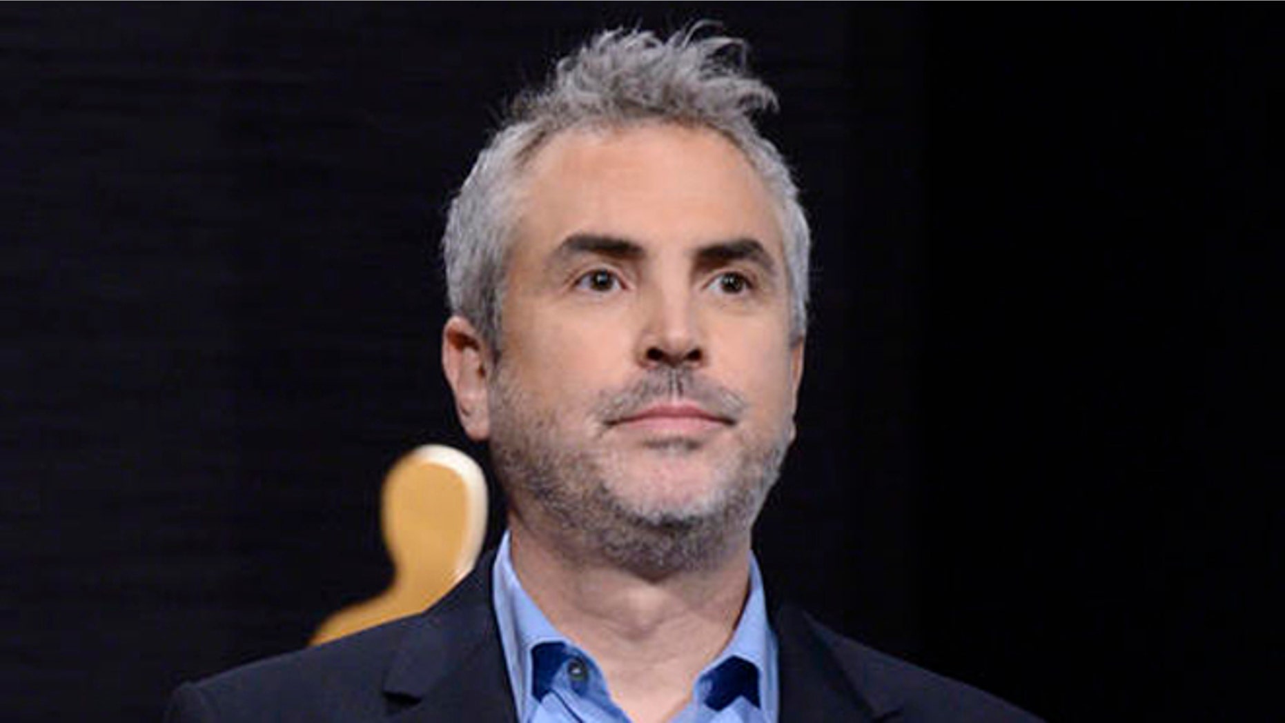 FILE - In this Jan. 15, 2015 file photo, Alfonso Cuaron announces the Academy Awards nominations at the 87th Academy Awards nomination ceremony in Beverly Hills, Calif. Cuaron's new project will take on a year in the life of a middle class family in Mexico City in the early 1970s. It will be his first film since Gravity which won seven Oscars in 2014, including Best Director. (Photo by Dan Steinberg/Invision/AP, File)