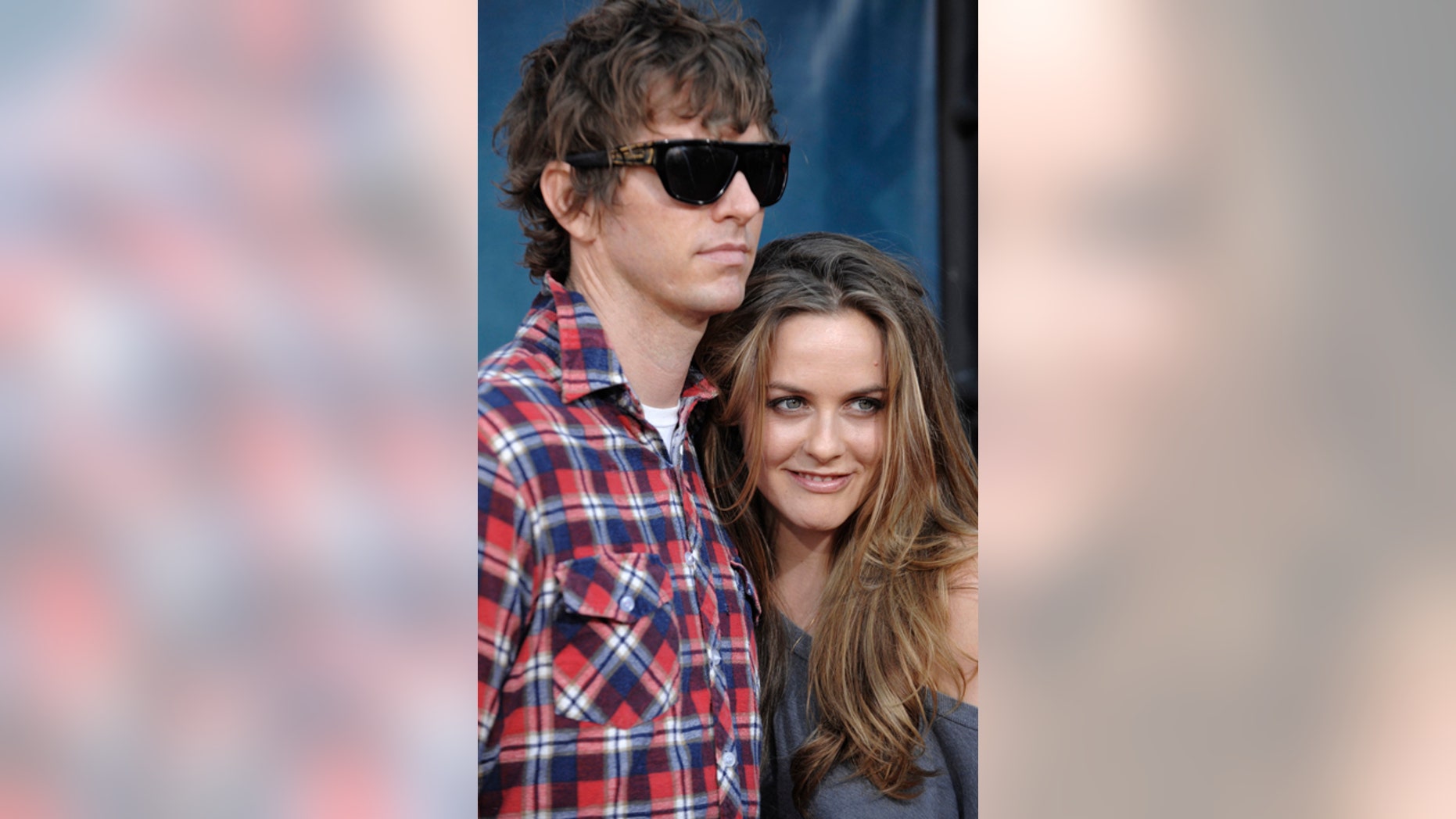 FILE - In this Thursday July 31, 2008 file photo, Christopher Jarecki and Alicia Silverstone arrive at the premiere of "Pineapple Express" in Mann Village Theater in Los Angeles. Alicia Silverstone is divorcing her husband of nearly 13 years. The "Clueless" actress filed for divorce from Christopher Jarecki on Friday, May 25, 2018 in Los Angeles County Superior Court