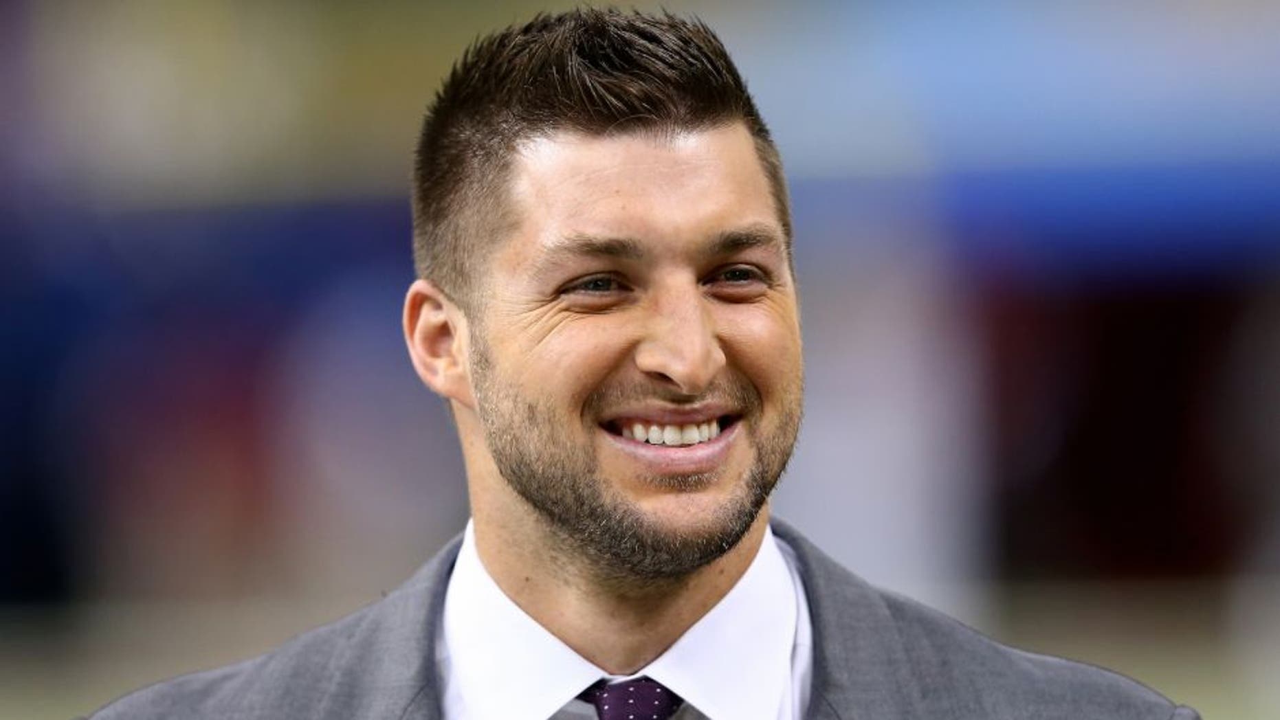 NEW ORLEANS, LA - JANUARY 01: Former University of Florida quarterback Tim Tebow is seen on the sidelines prior to the start of the game during the All State Sugar Bowl at the Mercedes-Benz Superdome on January 1, 2015 in New Orleans, Louisiana. (Photo by Streeter Lecka/Getty Images)