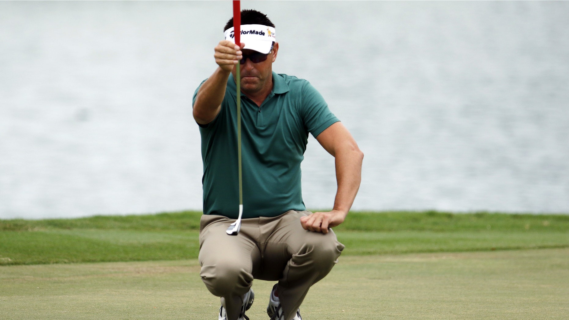 Jan. 16, 2015: Robert Allenby, of Australia, lines up his ball on the third green during the second round of the Sony Open golf tournament.