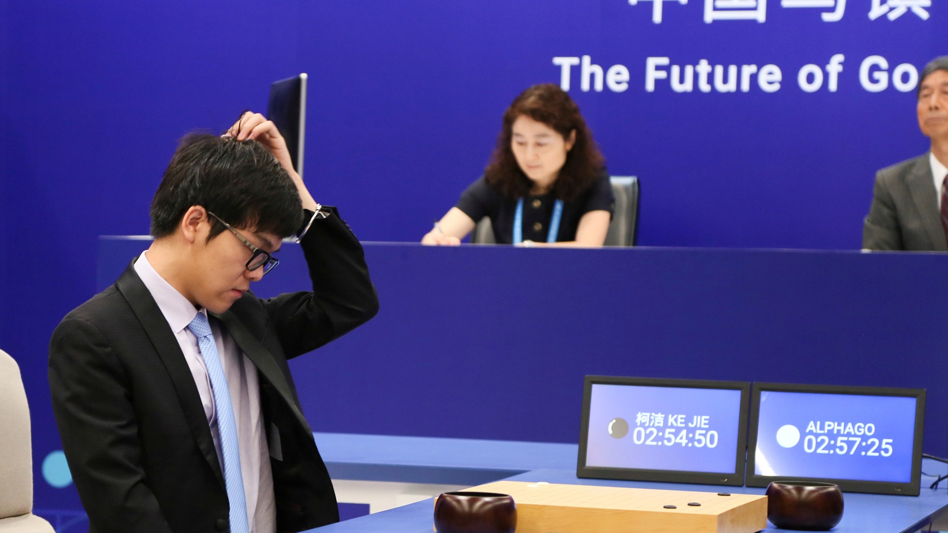 Chinese Go player Ke Jie reacts during his first match with Google's artificial intelligence program AlphaGo at the Future of Go Summit in Wuzhen, Zhejiang province, China May 23, 2017. (REUTERS/Stringer)