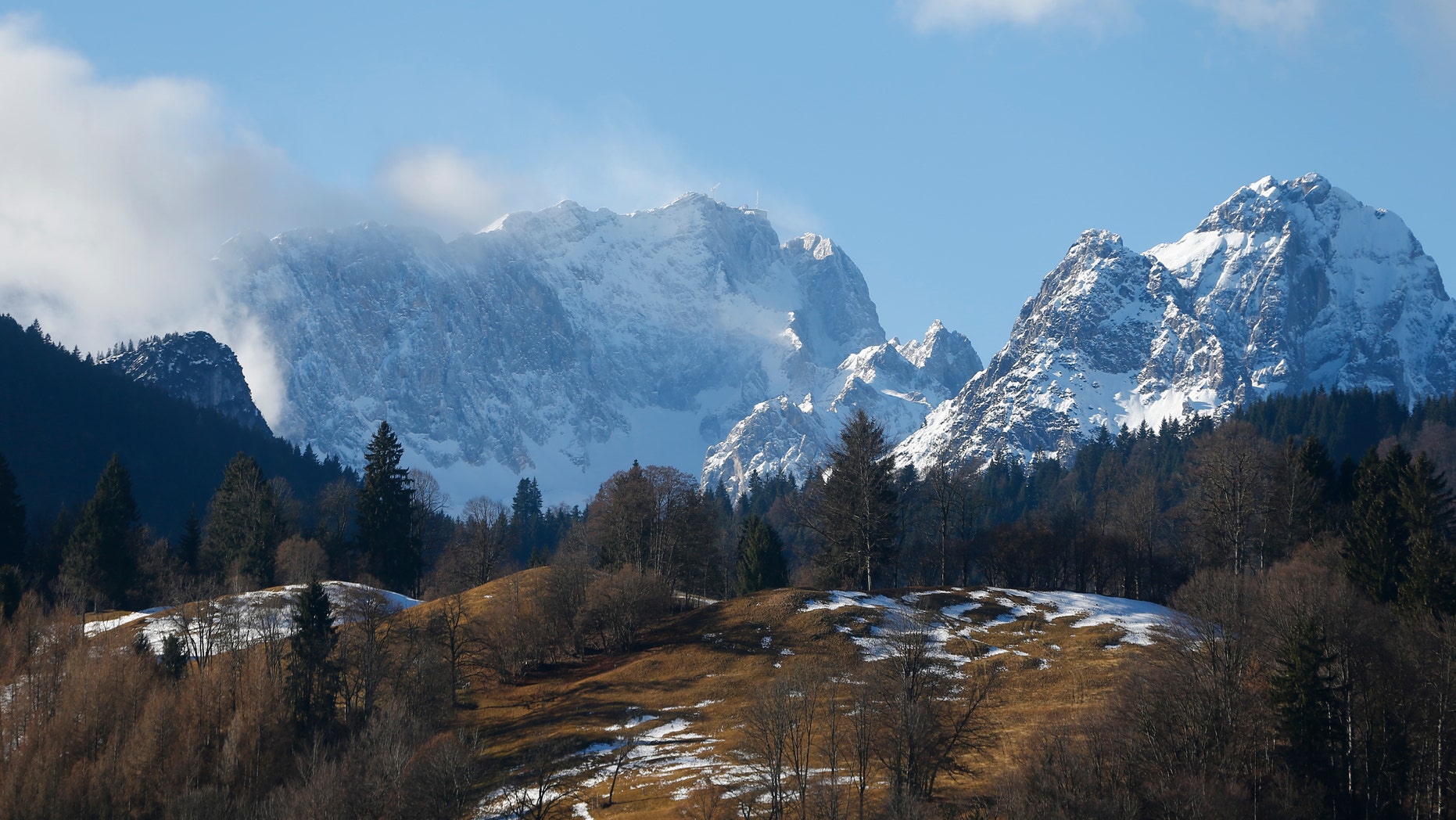 Germany's highest mountain, 9,718 feet Zugspitze (L) is pictured from the Bavarian ski resort of Garmisch-Partenkirchen, Germany, Jan. 29, 2016. (REUTERS/Dominic Ebenbichler)