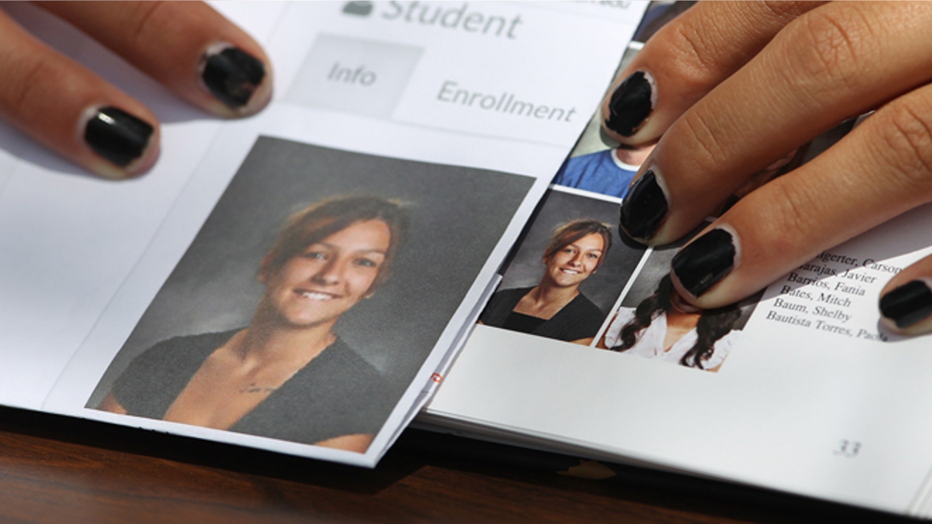 May 29: Wasatch High School sophomore Shelby Baum, 16, points to yearbook proof, left, and her altered school yearbook photo in Heber City.