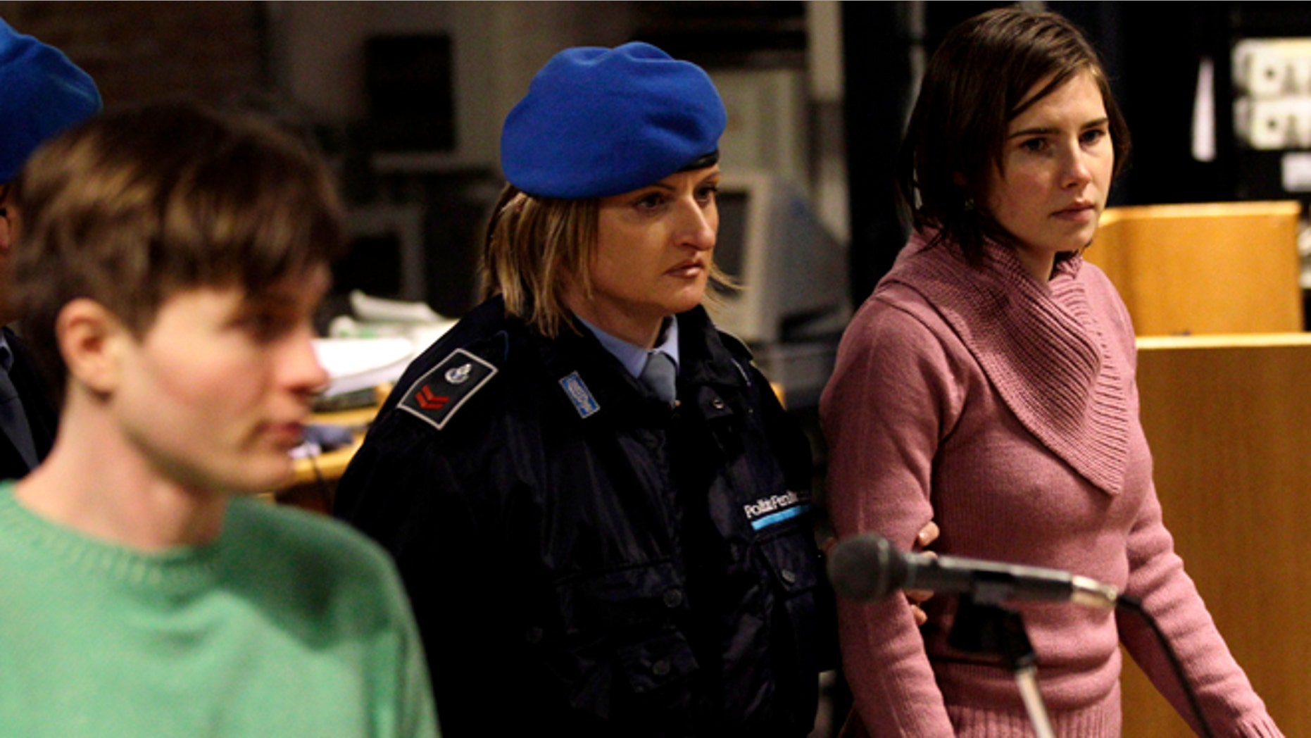 Dec. 18, 2010: In this file photo, U.S. student Amanda Knox, right, walks past Raffaele Sollecito, as she arrives after a break to attend a hearing in her appeals trial at Perugia's courthouse in Italy. Italy's highest criminal court has overturned the acquittal of Amanda Knox and of her former Italian boyfriend, Raffaele Sollecito, in the slaying of her British roommate and ordered a new trial.