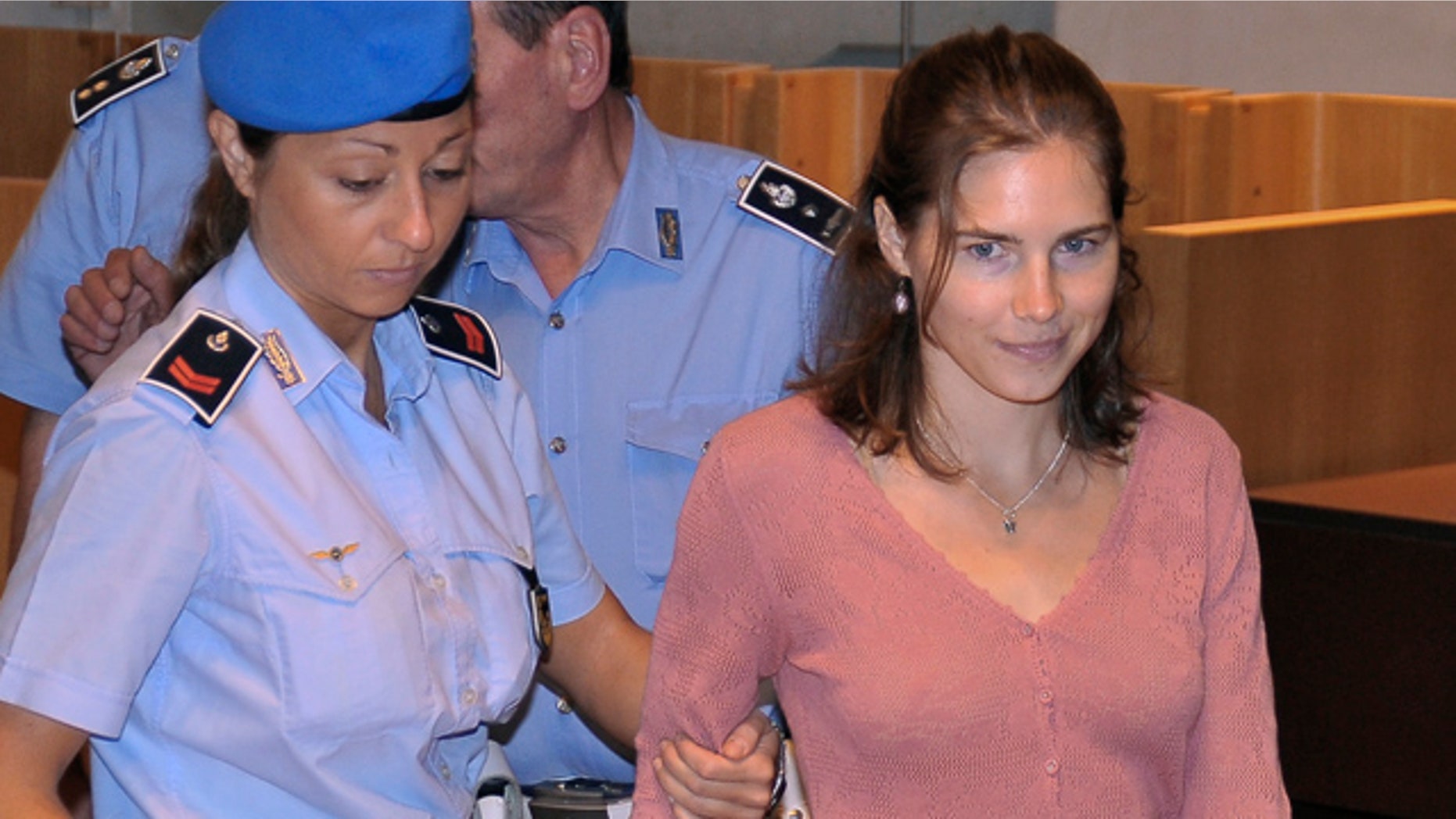 July 30: American student Amanda Knox arrives for a hearing of her appeals murder trial, in Perugia, Italy.