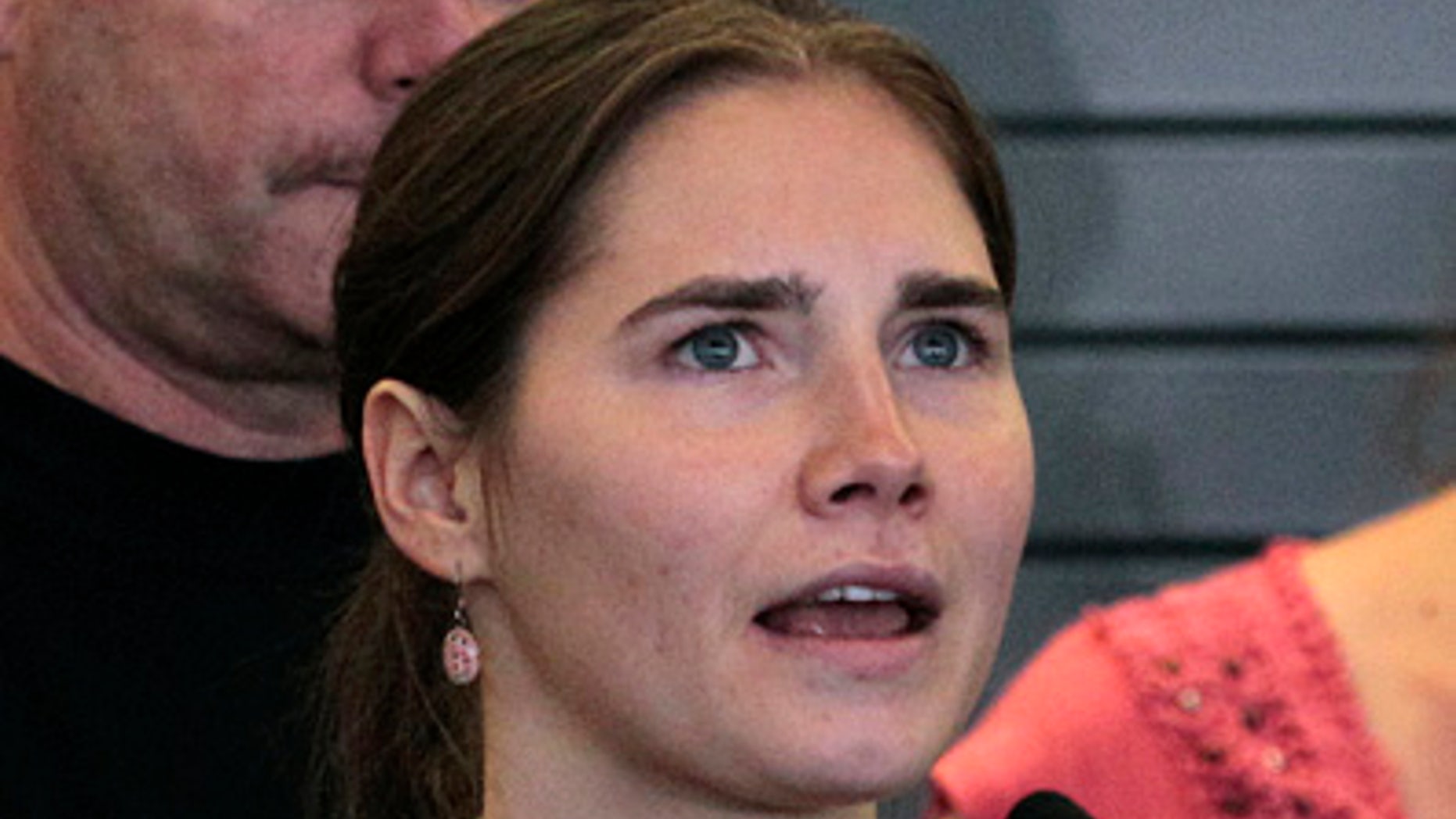 This Oct. 4, 2011 file photo shows Amanda Knox speaking at a news conference shortly after her arrival at Seattle-Tacoma International Airport in Seattle. The appellate court in Italy that cleared Knox in the slaying of her British roommate has released the reasoning behind its ruling. The appellate court released its 144-page reasoning for reversing the earlier verdict on Thursday, Dec. 15, 2011.