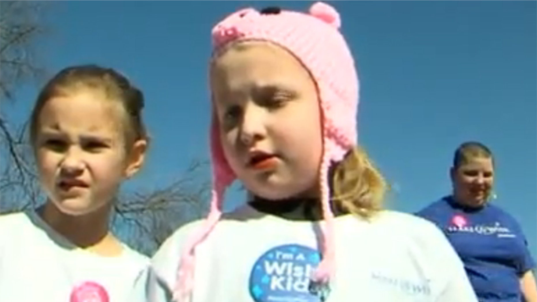 Amelia Meyer, center, used her Make-A-Wish to clean up her local park.