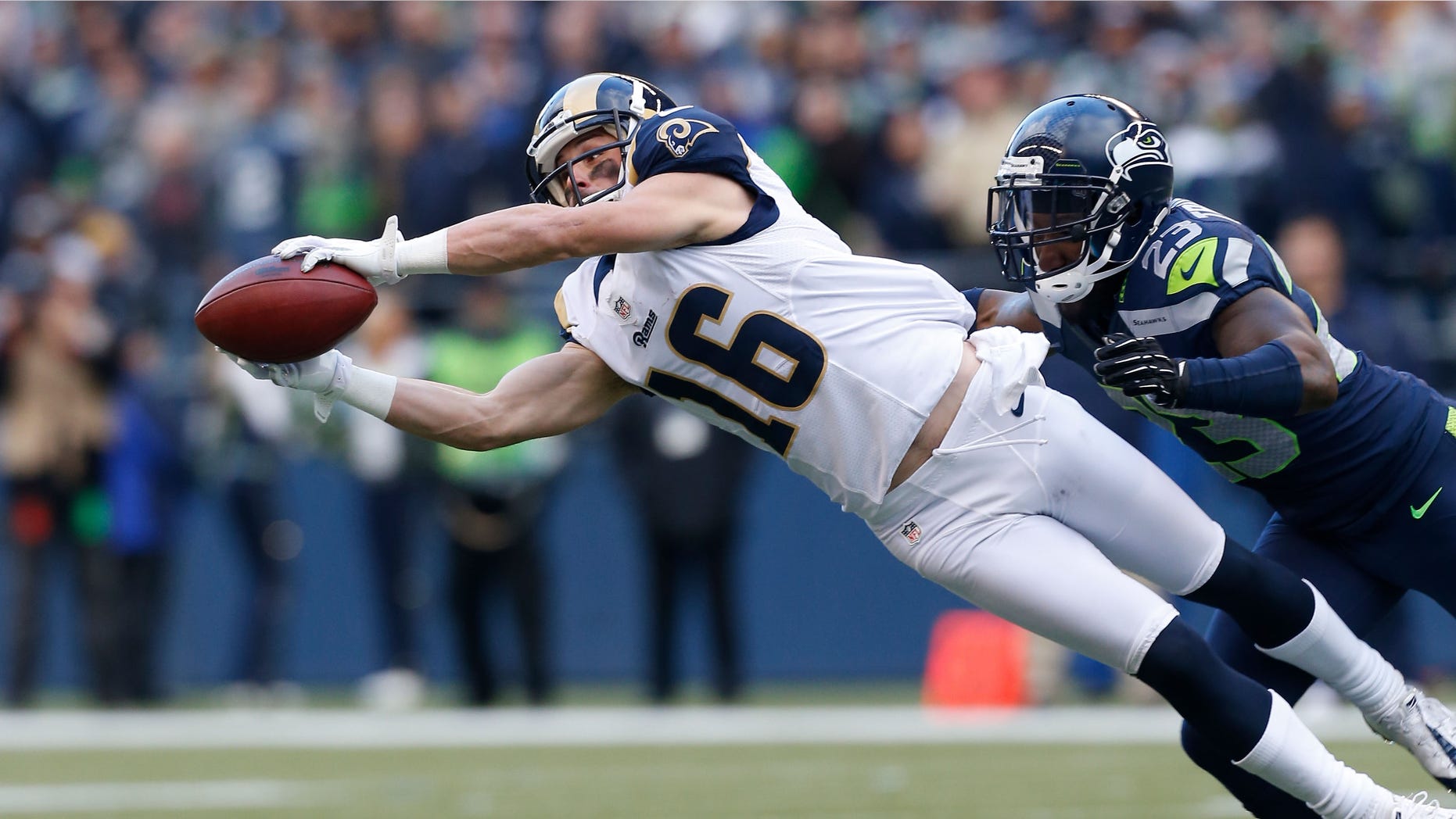 SEATTLE, WA - DECEMBER 30: Wide receiver Danny Amendola #16 of the St. Louis Rams makes a diving catch against cornerback Marcus Trufant #23 of the Seattle Seahawks at CenturyLink Field on December 30, 2012 in Seattle, Washington. (Photo by Otto Greule Jr/Getty Images)