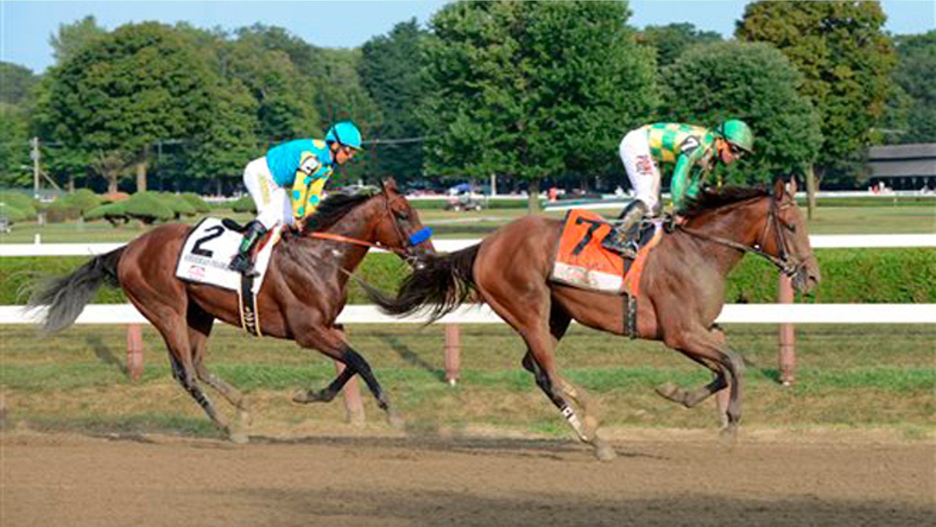 Aug. 29, 2015: Keen Ice , right, with Javier Castellano, right, slows after winning the Travers Stakes ahead of American Pharoah, with jockey Victor Espinoza, at Saratoga Race Course in Saratoga Springs, N.Y.