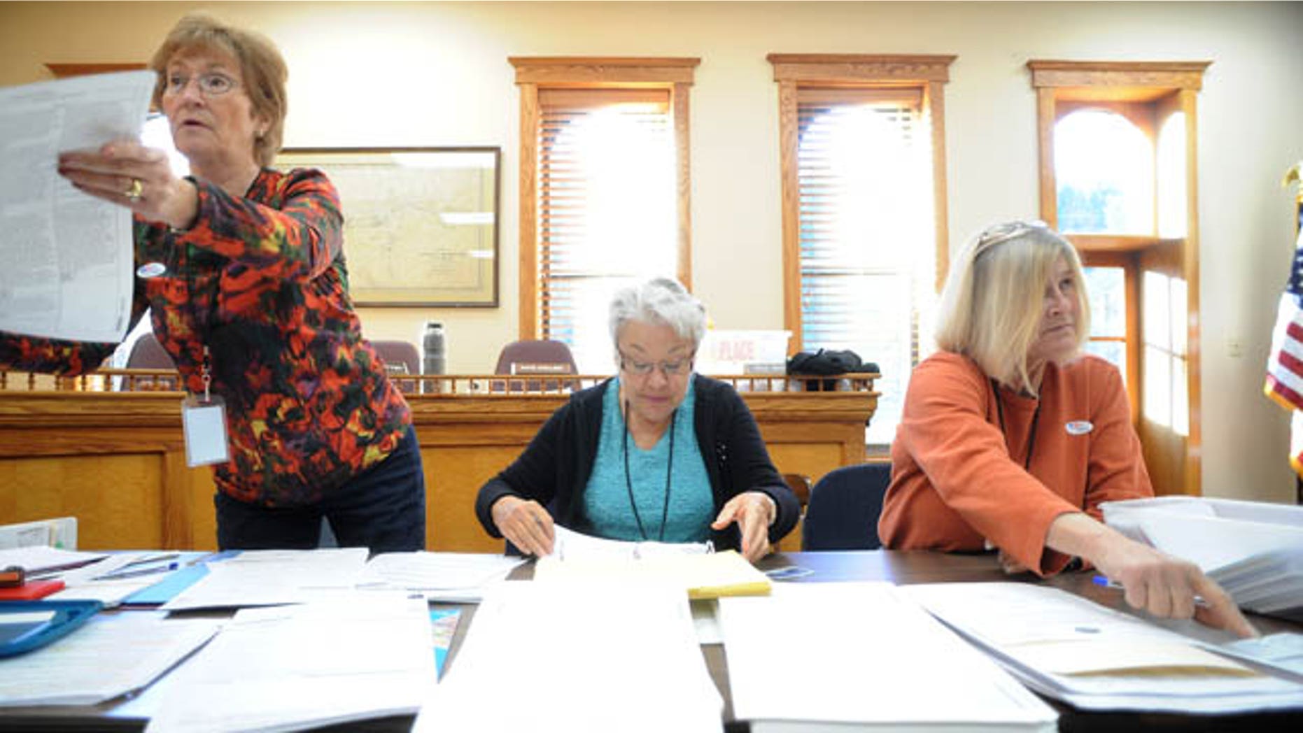 Election officials help voters at the Idaho Springs Courthouse in Idaho Springs, Colo. (AP)